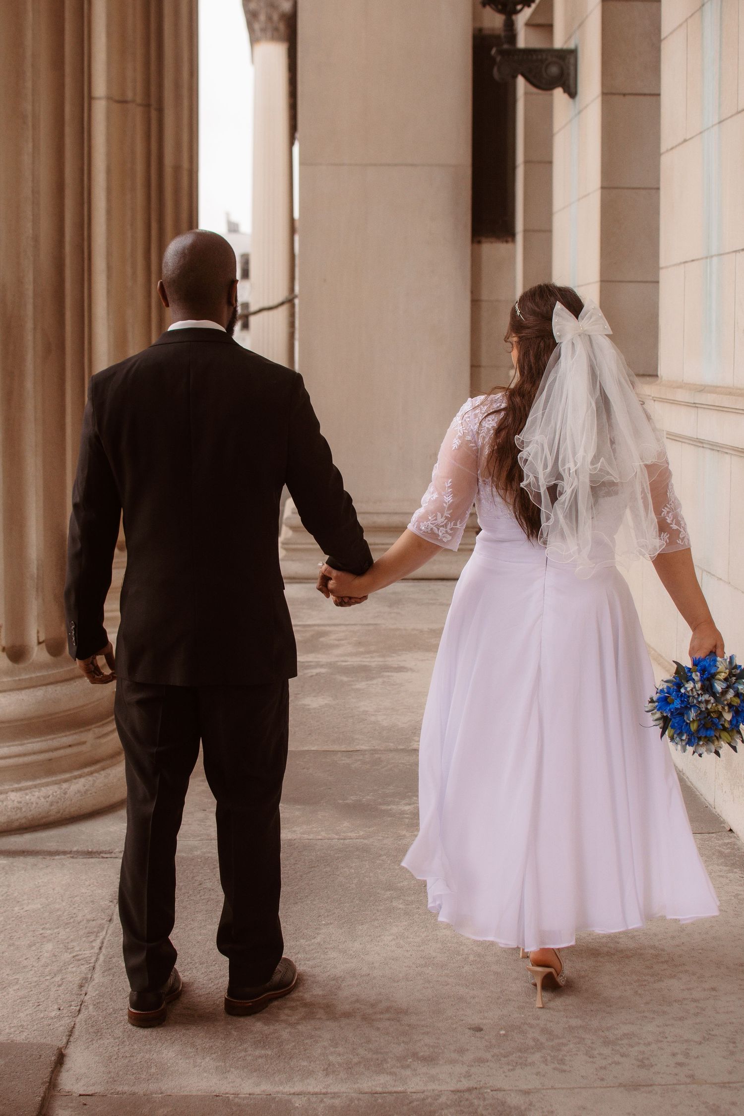 A series of wedding photos showing couples walking between elegant columns in formal attire and white dresses.
