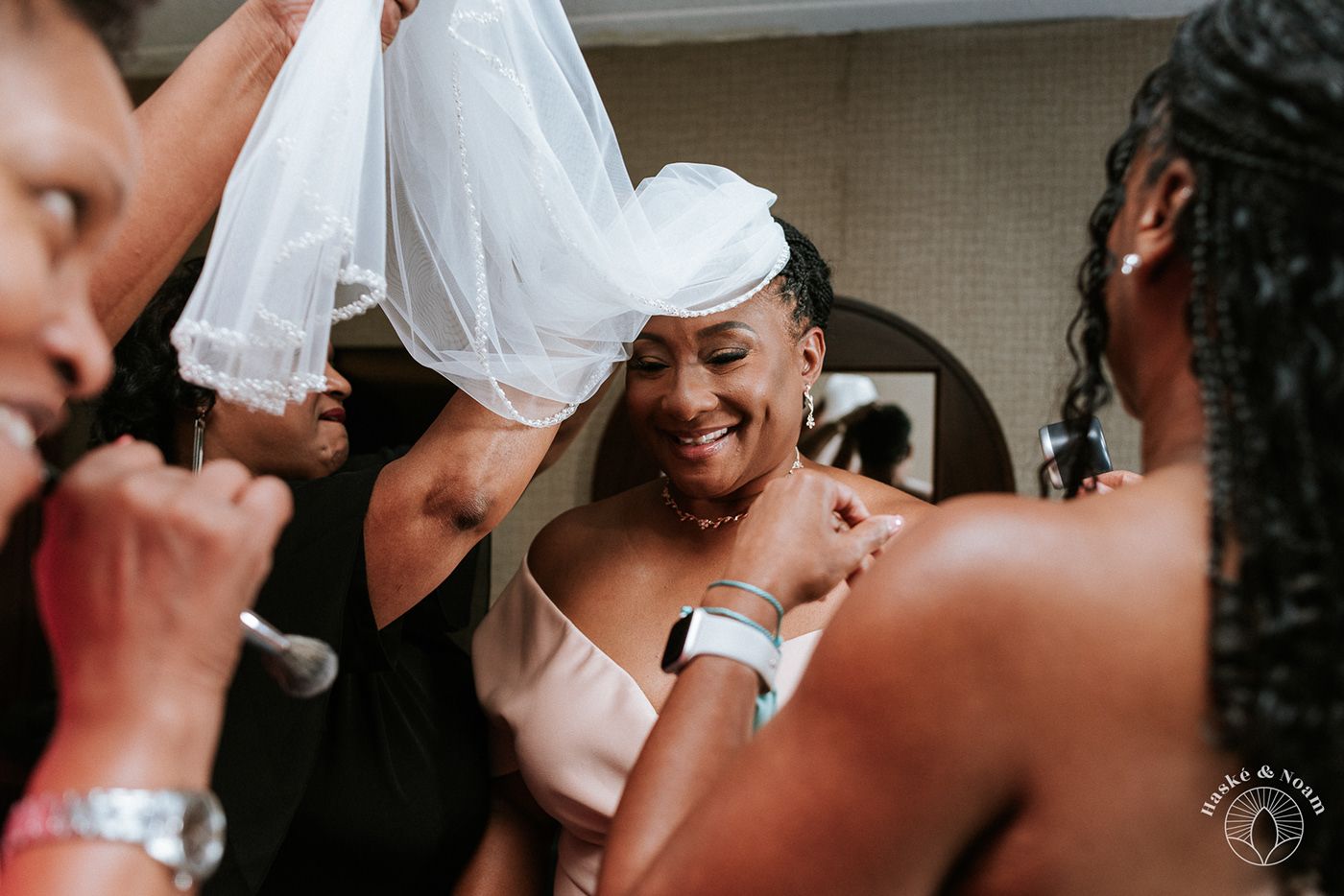 Candid moment of joy and laughter during wedding celebrations.