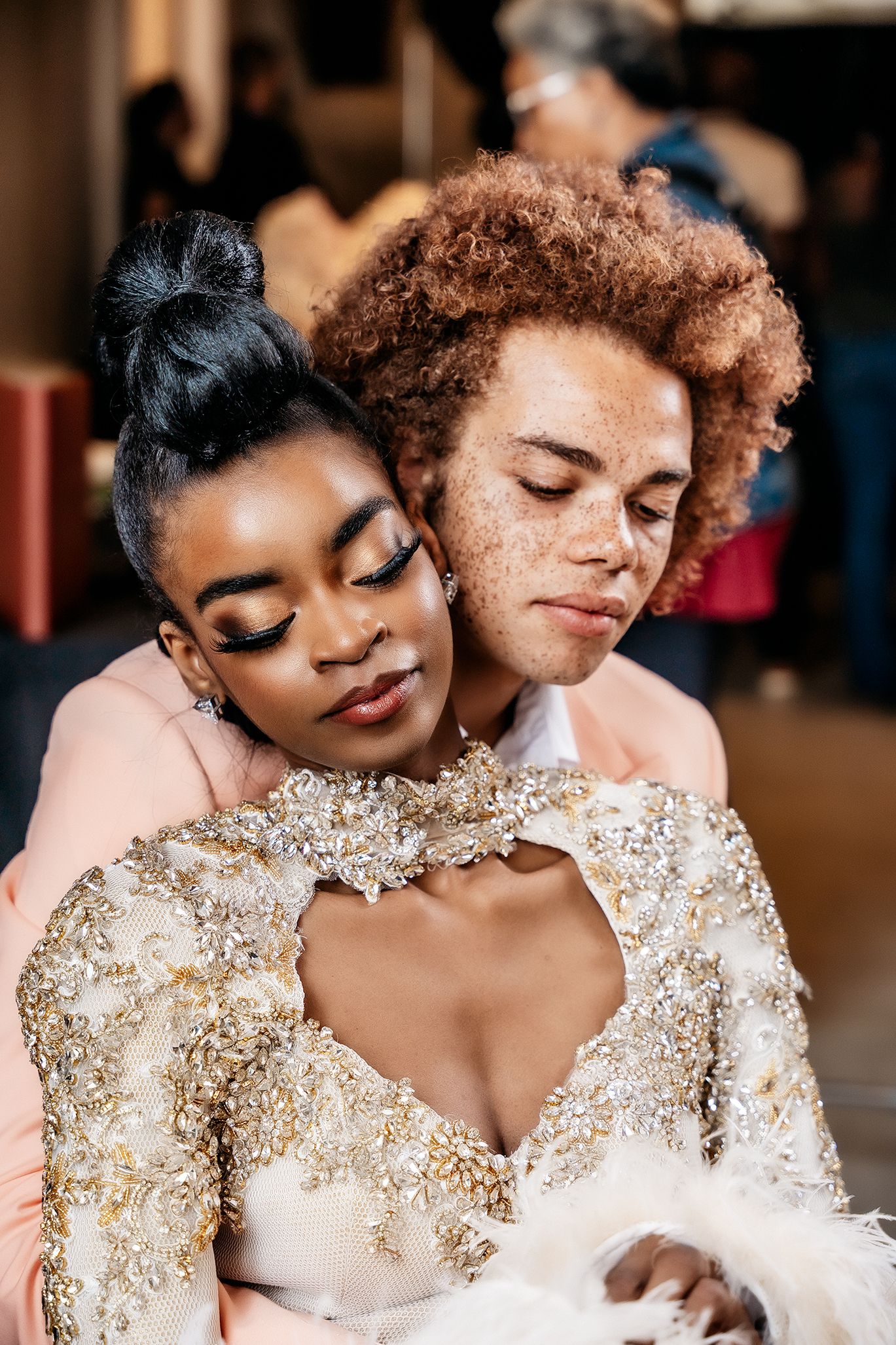 Intimate portrait of two people sharing a tender moment in formal attire.