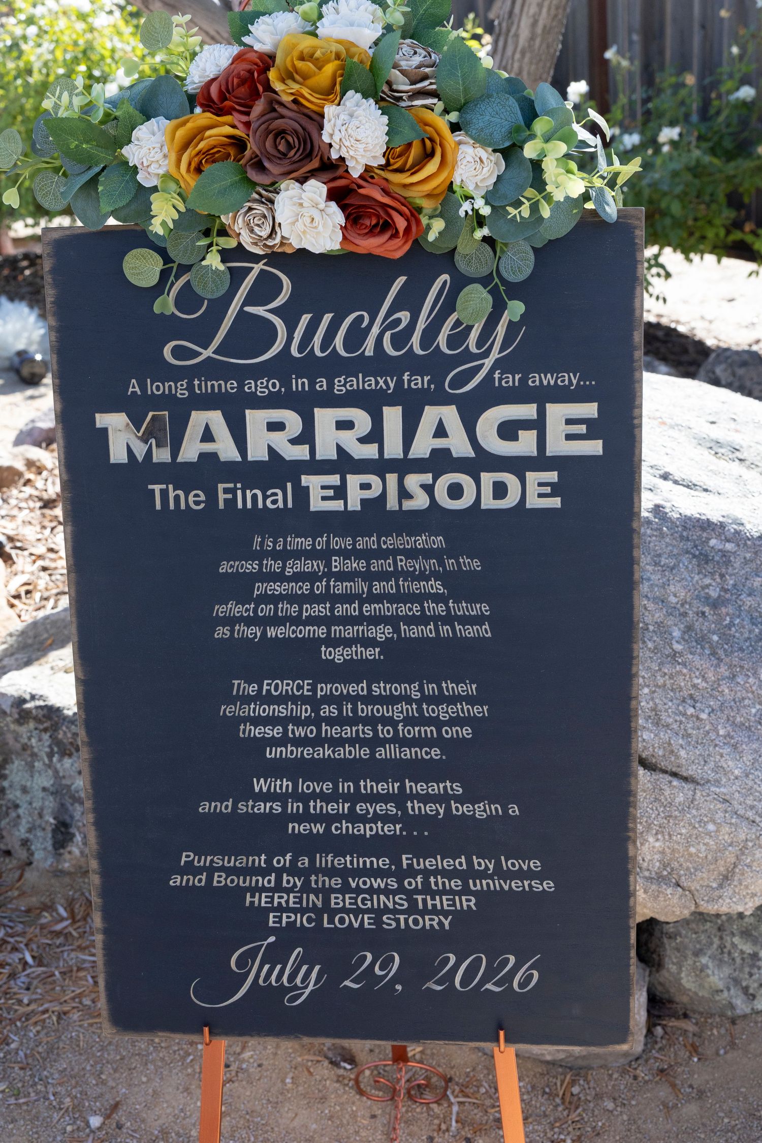 Star Wars themed Buckley wedding sign announcing Blake and Roslyn's marriage on July 29, 2026, decorated with colorful flowers.