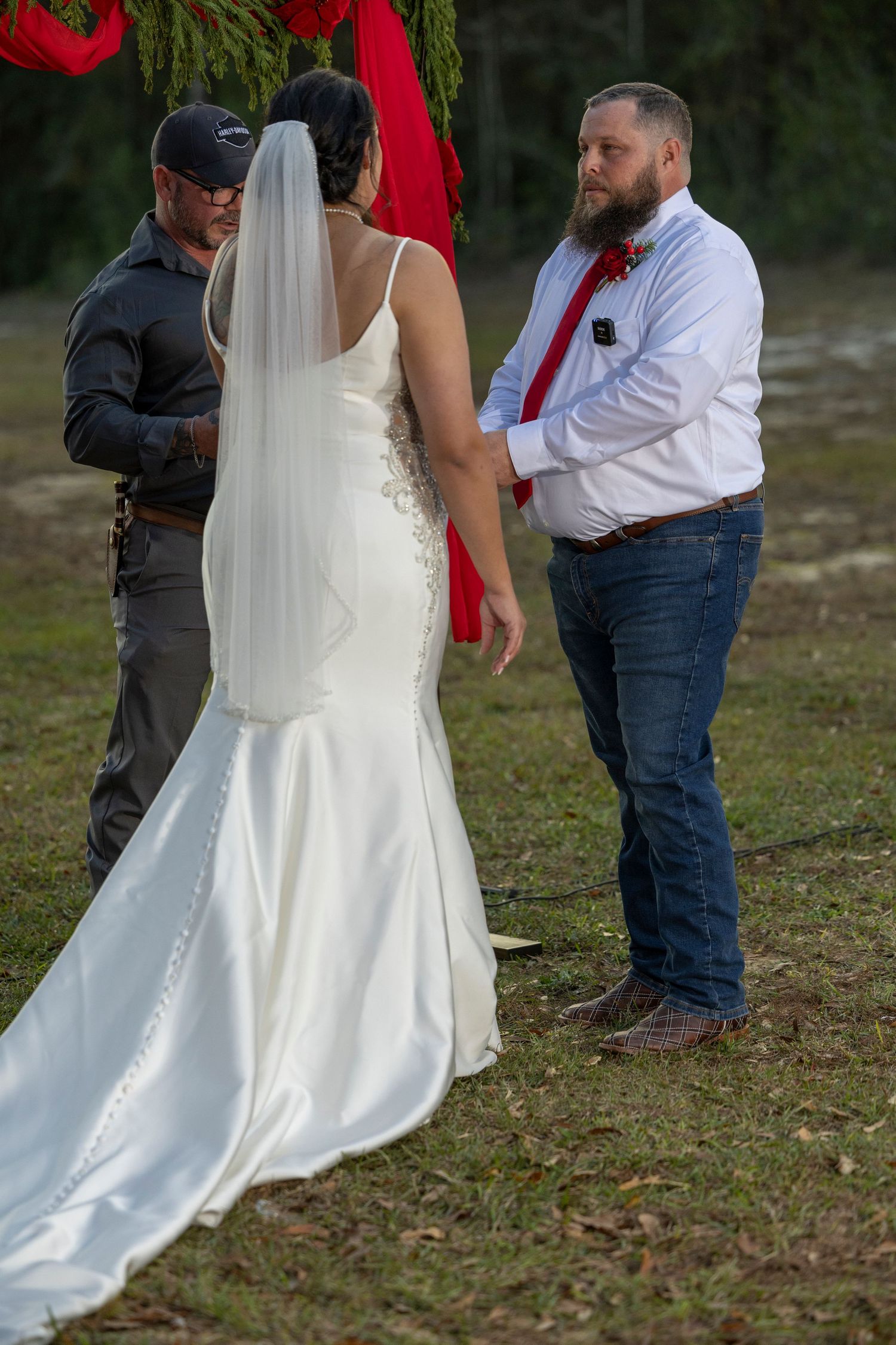 A series of wedding photos showing the bottom half of a white bridal gown and dress shoes against grass and foliage.