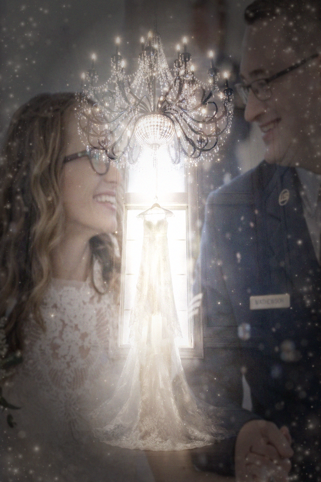 Dreamy wedding scene with elegant crystal chandeliers casting a soft ethereal glow through a romantic vintage filter effect.