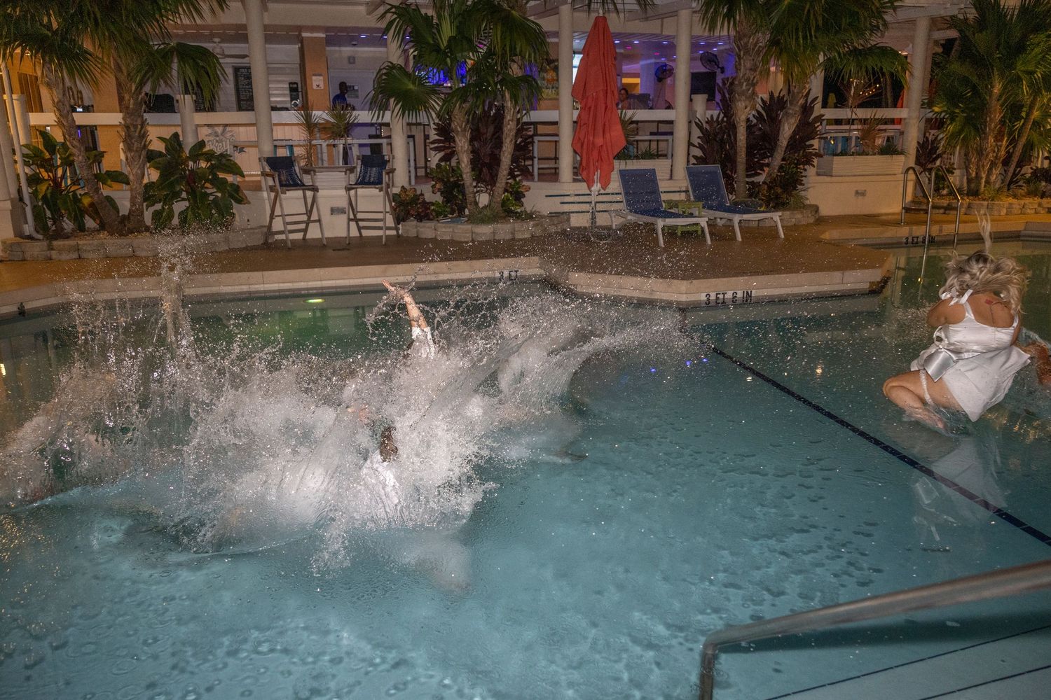A sequence of splash photos showing someone diving into a swimming pool with increasing water displacement.