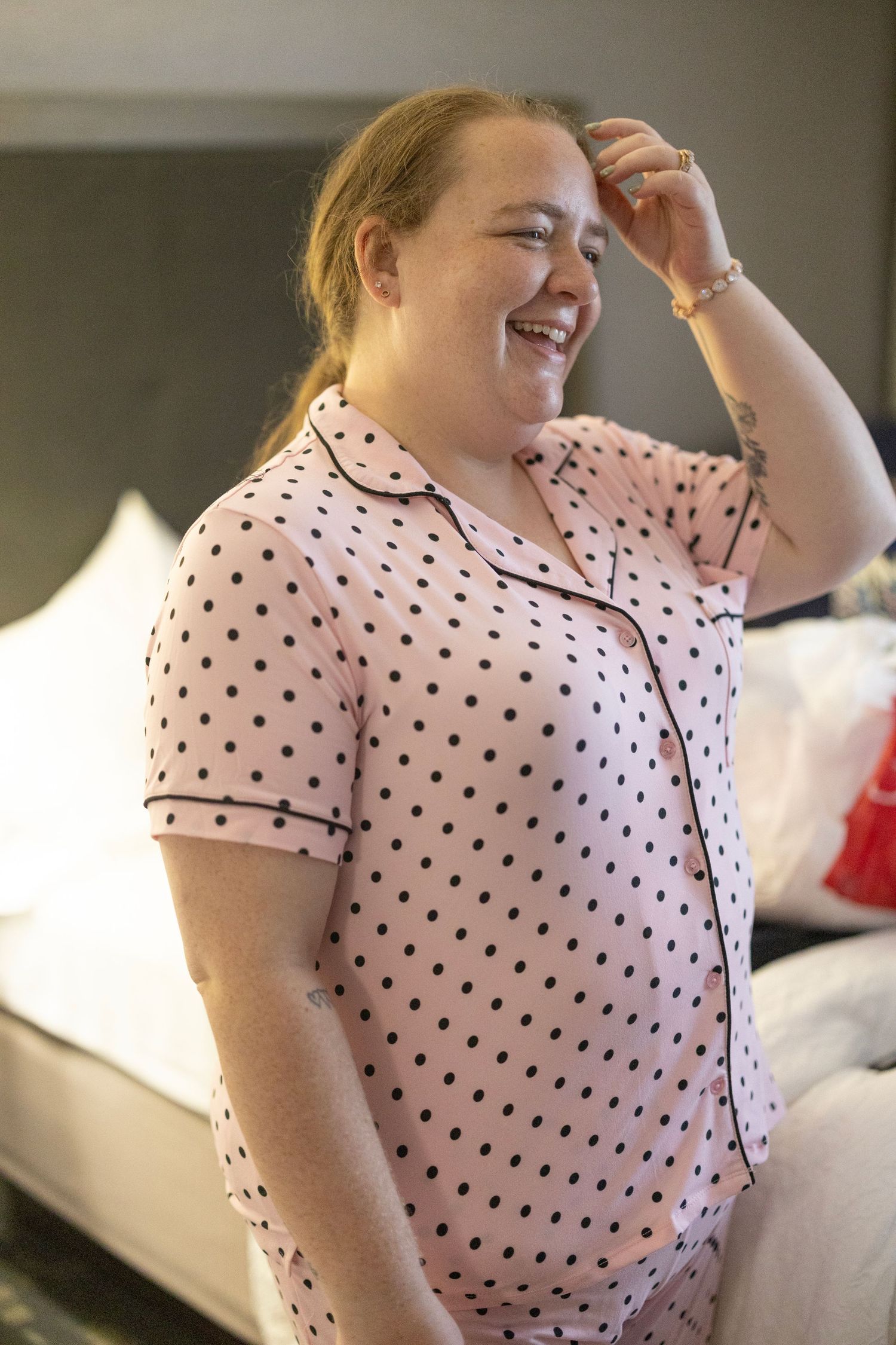 A sequence of photos shows someone wearing a white and black polka dot shirt expressing joyful laughter.