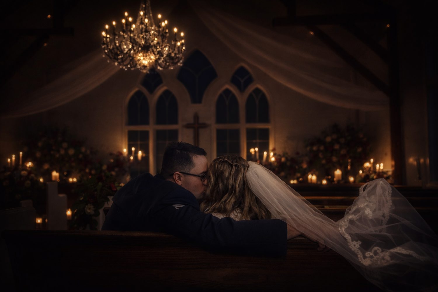 A romantic candlelit wedding reception venue with elegant chandeliers and soft lighting creating an intimate atmosphere.