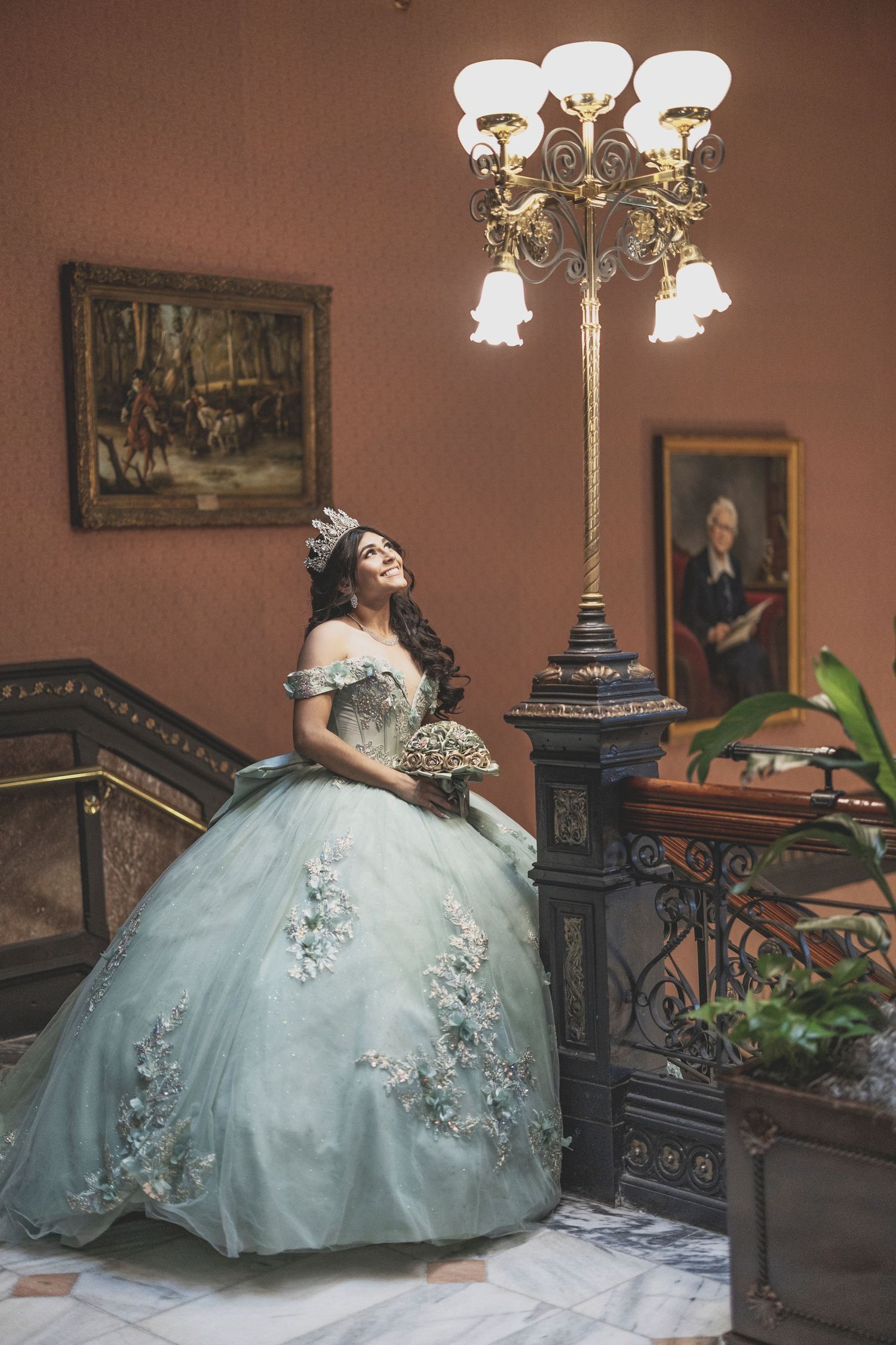 A series of photos showing a light blue ballgown dress in a vintage-style room with ornate furniture and decorative elements.