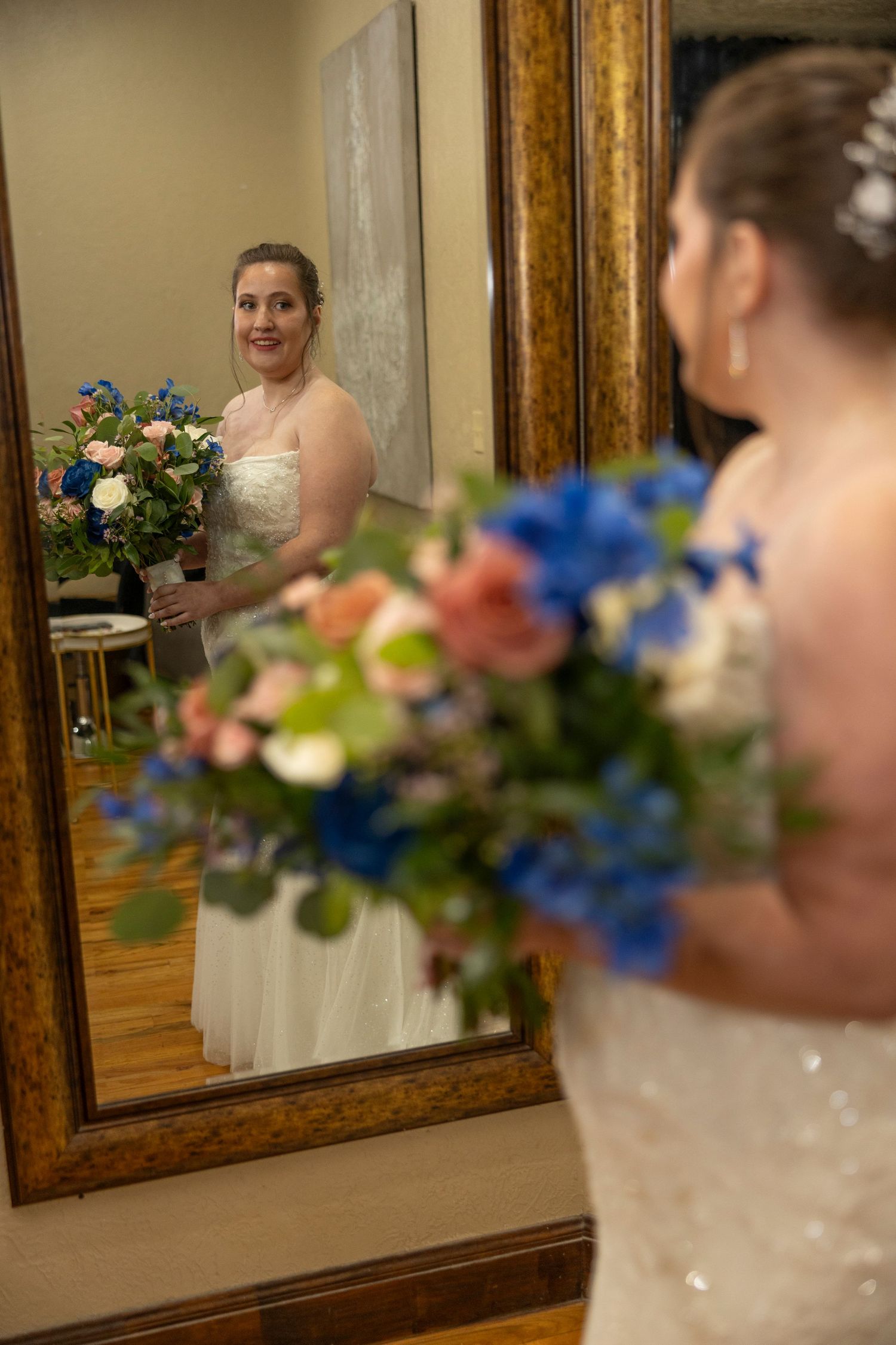 A series of mirror reflections shows a bride in a white dress with colorful floral arrangements in an elegant setting.