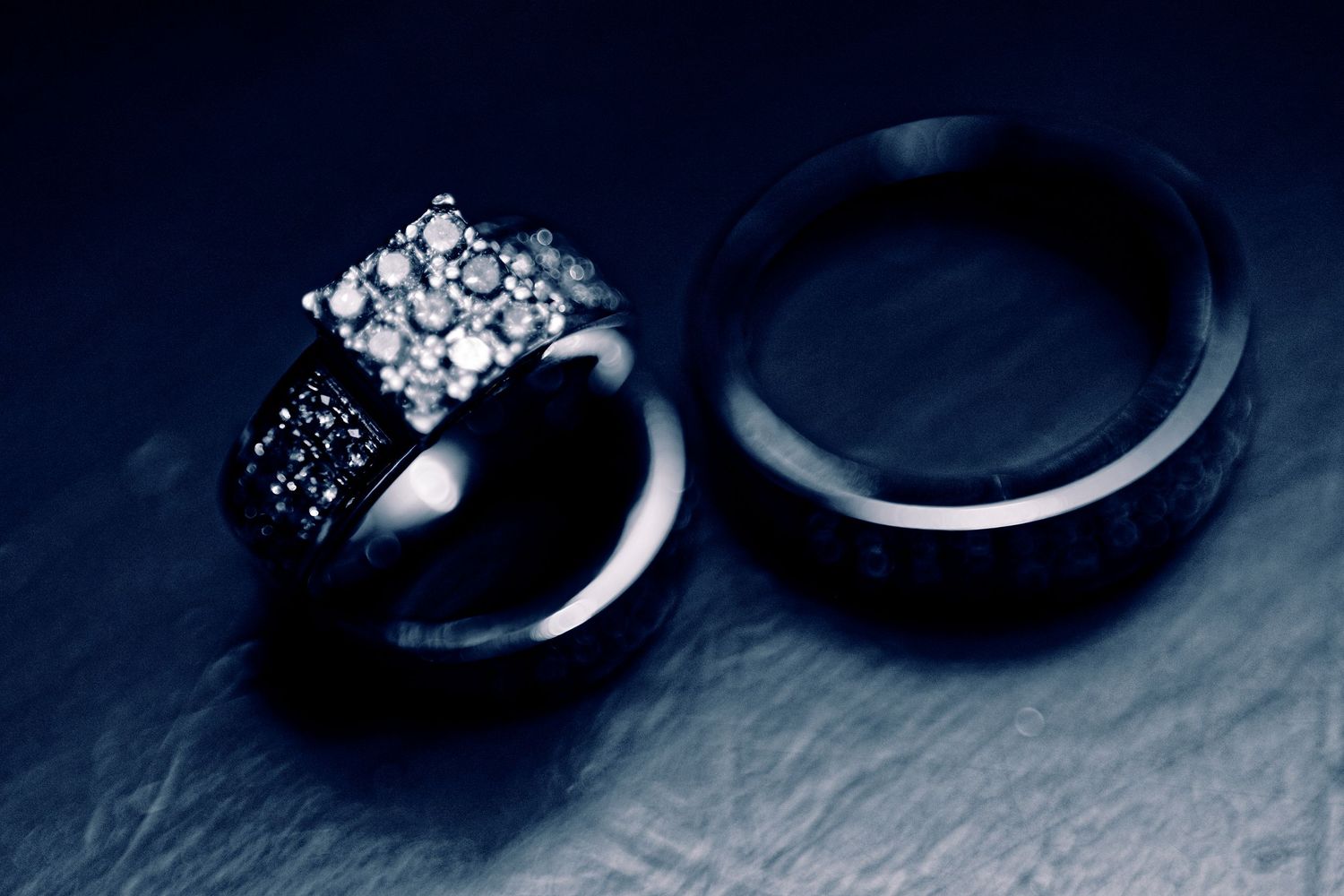 A sequence of close-up shots showing a silver ring with diamonds from different angles.