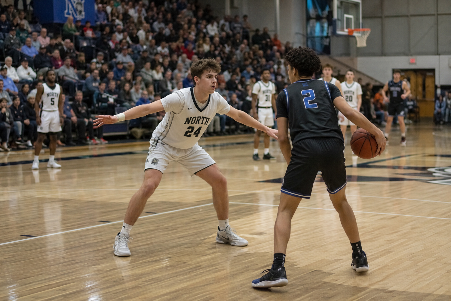 Basketball player #24 in white jersey plays defense against opponent #2 during an indoor high school basketball game.