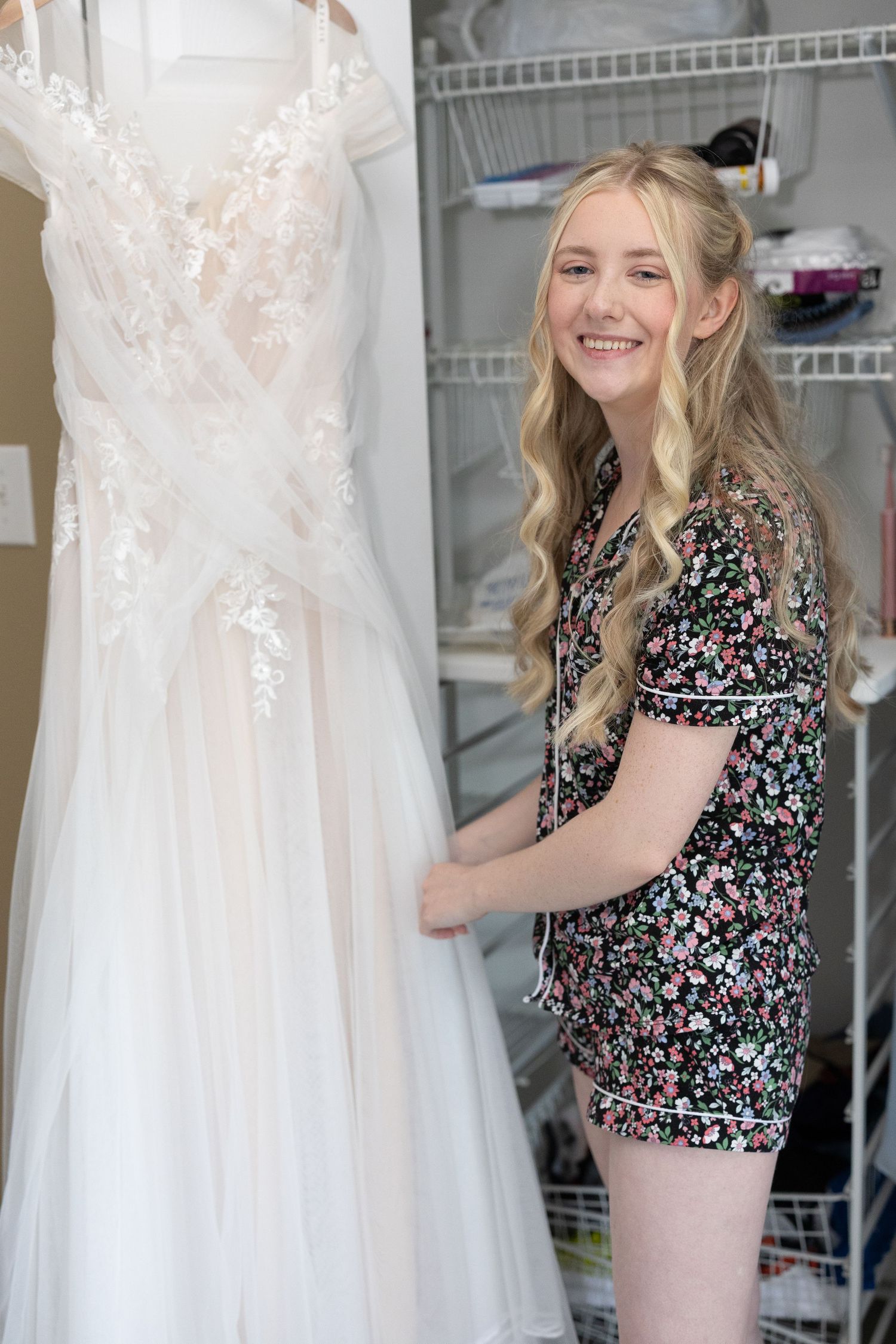 A series of photos showing someone in a floral print top looking at and organizing white wedding dresses in a closet.