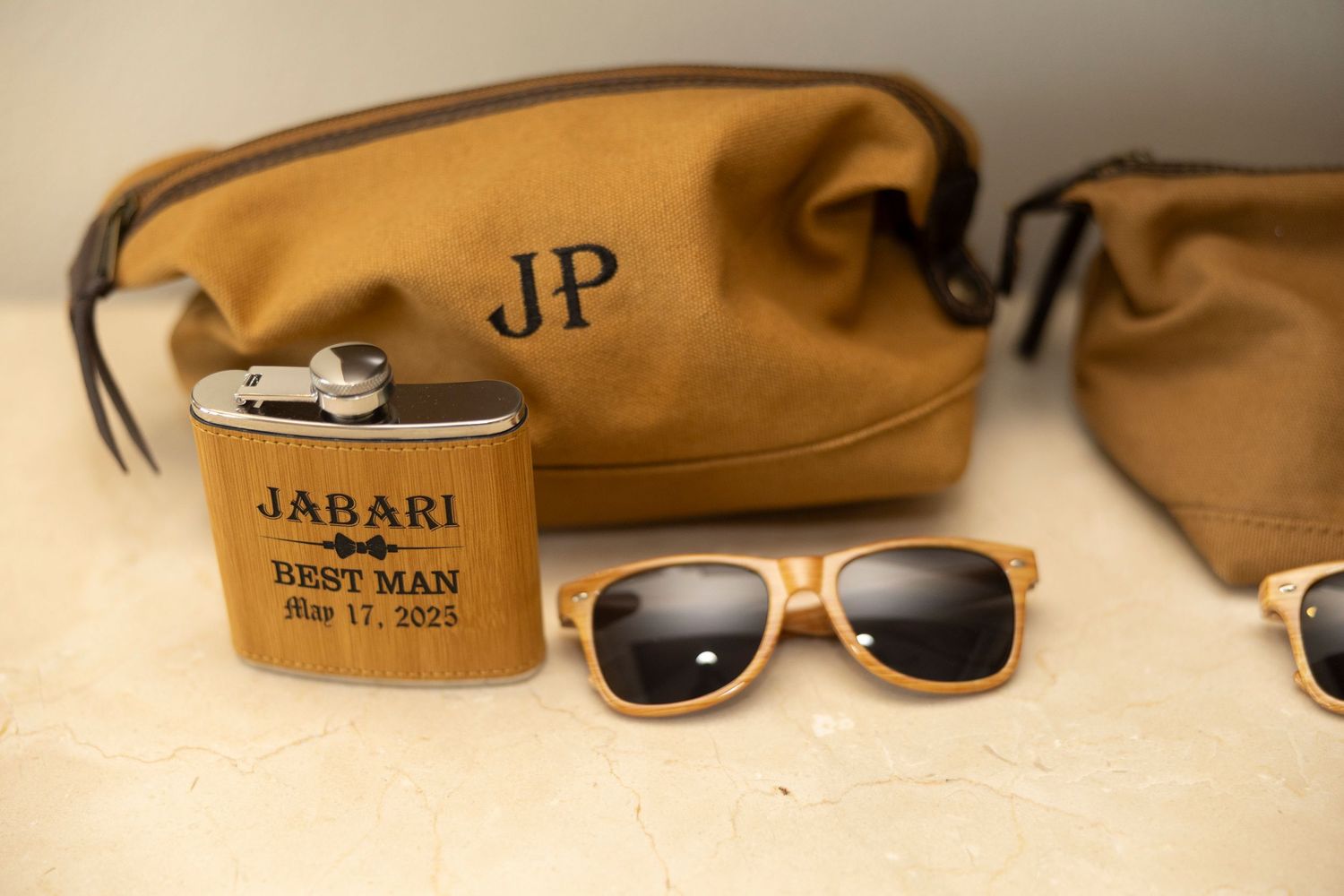 Stylish brown leather sunglasses case with sunglasses displayed on a light colored surface.