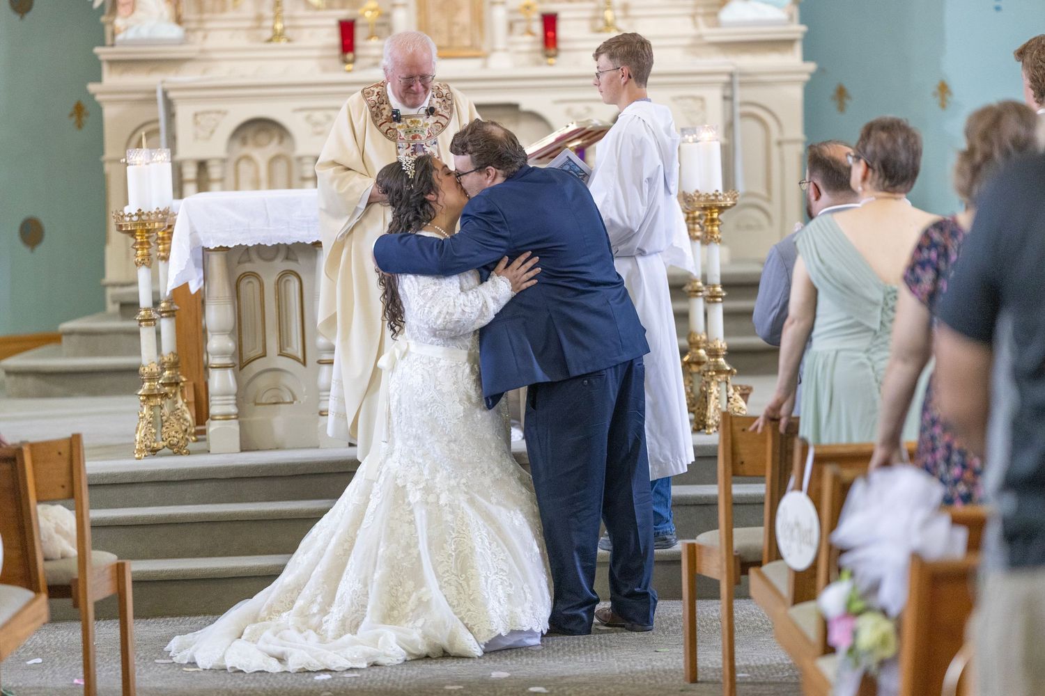 A series of wedding photos showing couples dancing and embracing in an elegant church or ballroom setting.