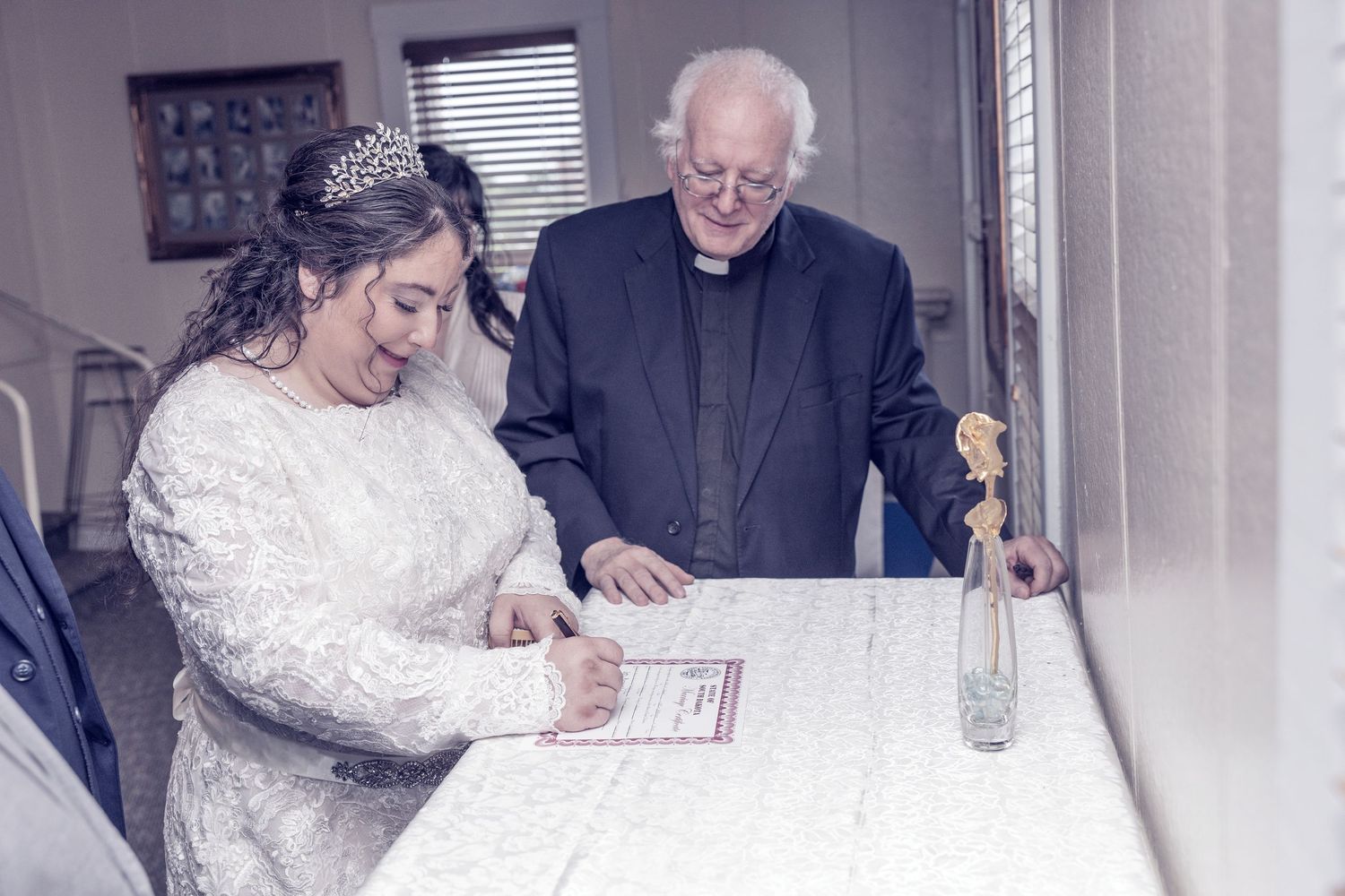 Four similar images showing people signing documents at a table during what appears to be a wedding ceremony.