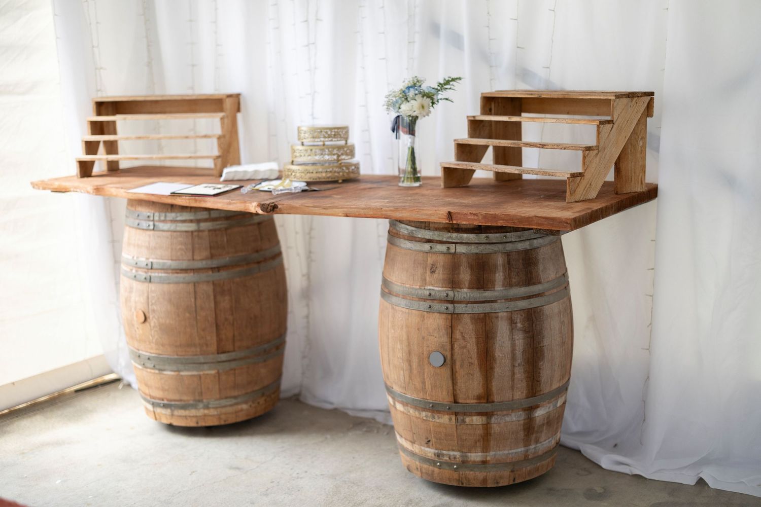 Rustic wooden wine barrel transformed into a stylish side table with a circular wooden top in a bright interior space.