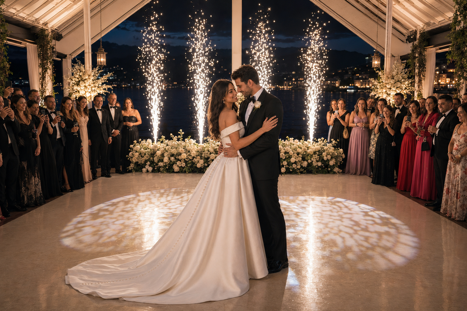 Bride and groom share first dance surrounded by sparkling fireworks and guests at elegant wedding reception.