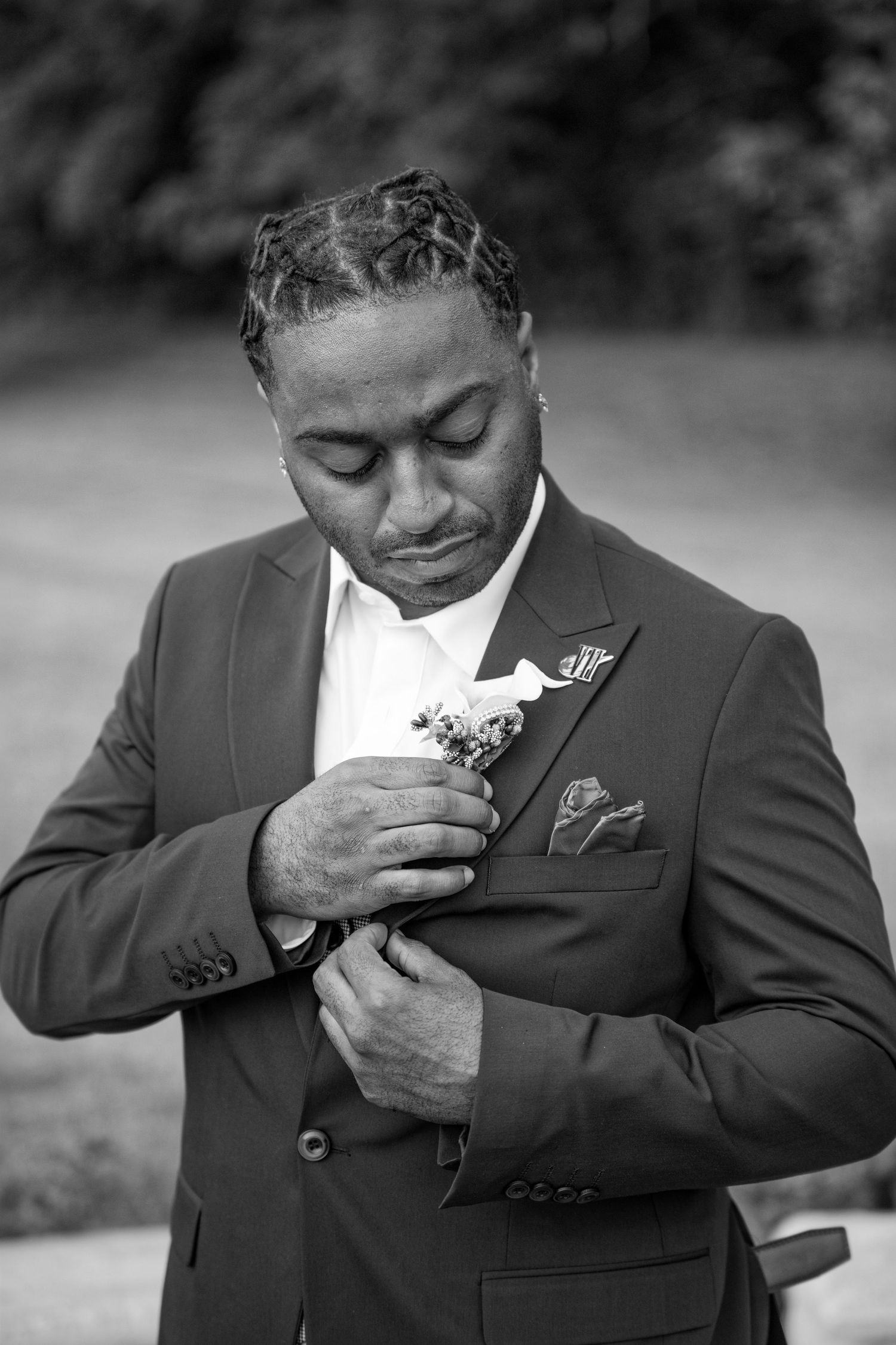 Black and white photo sequence showing emotional reaction while smelling a boutonniere flower on a suit lapel.