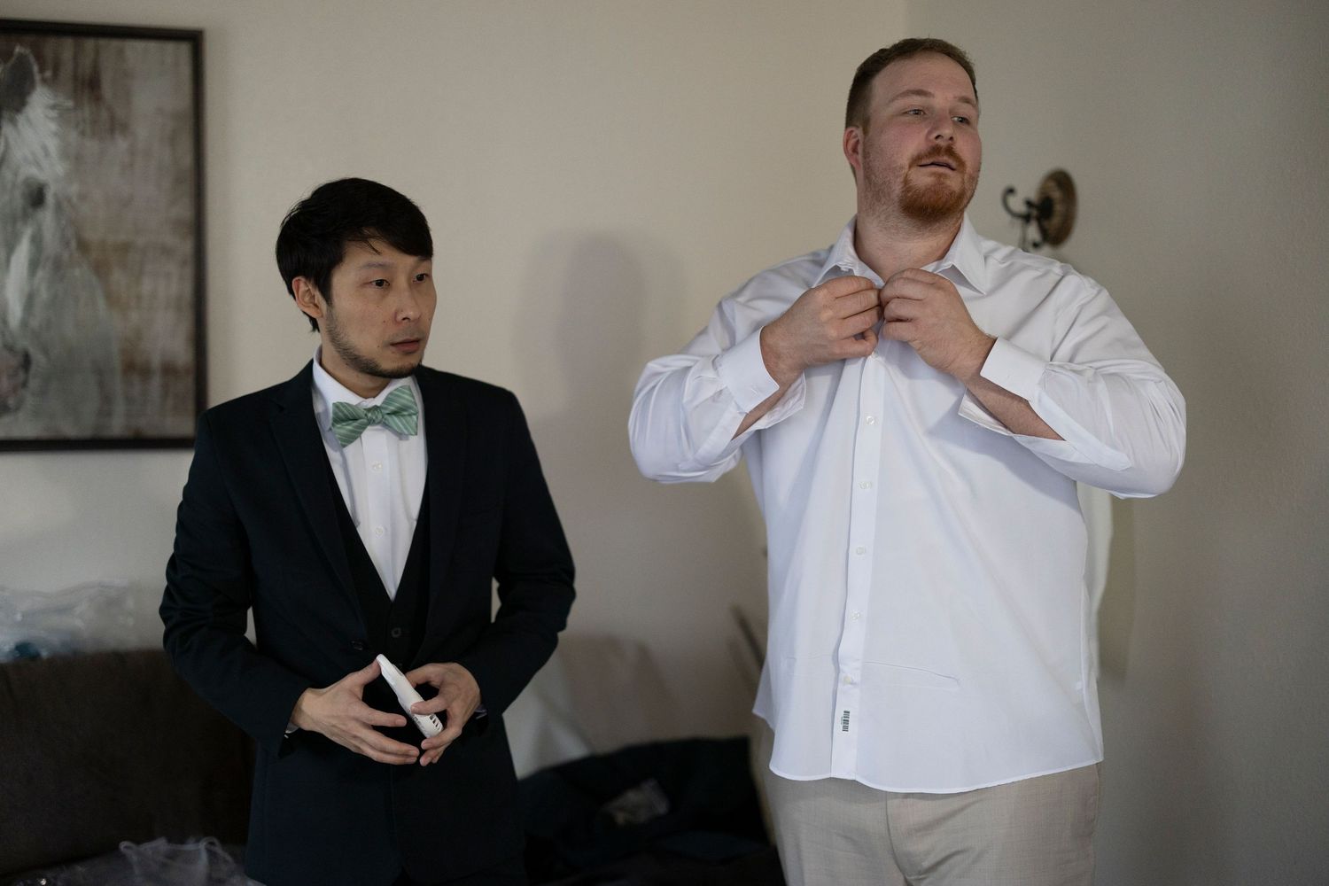A series of black and white photos showing people getting dressed in formal attire and adjusting their bowties.