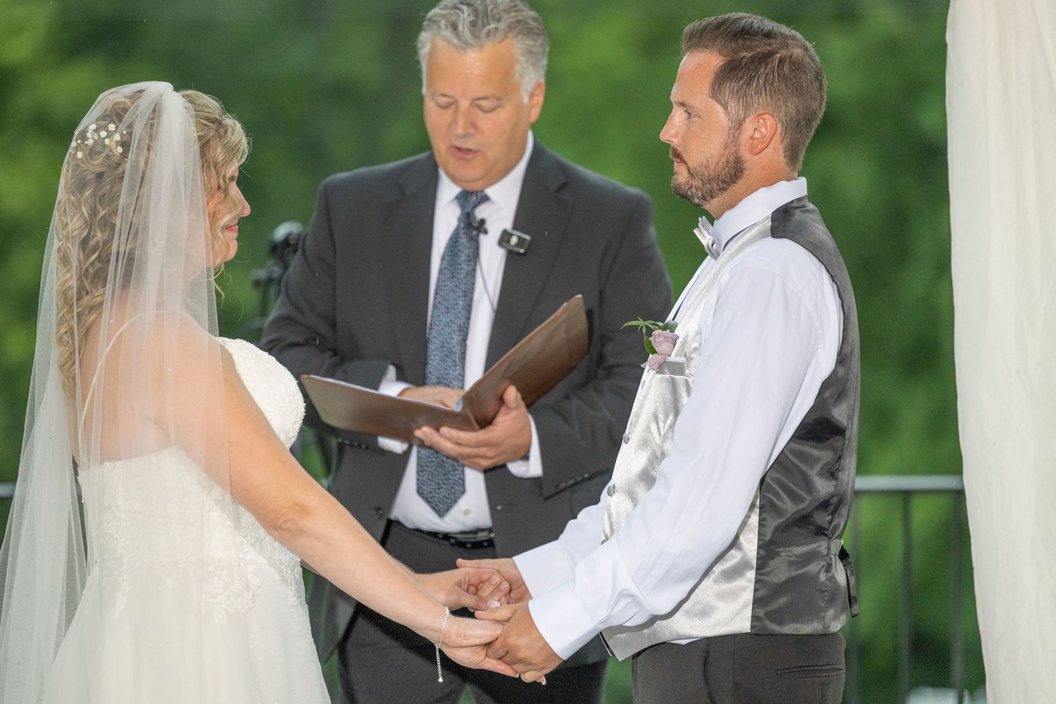 A series of four wedding ceremony photos showing a couple exchanging vows outdoors with an officiant present.