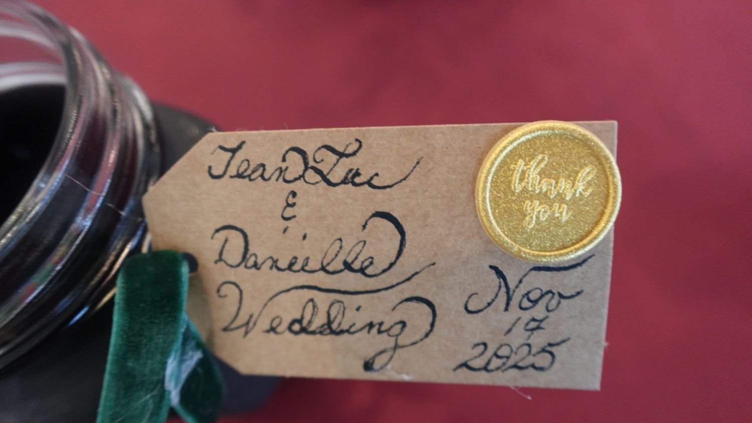 A collection of vintage labels and tags with handwritten text attached to various items in muted tones.
