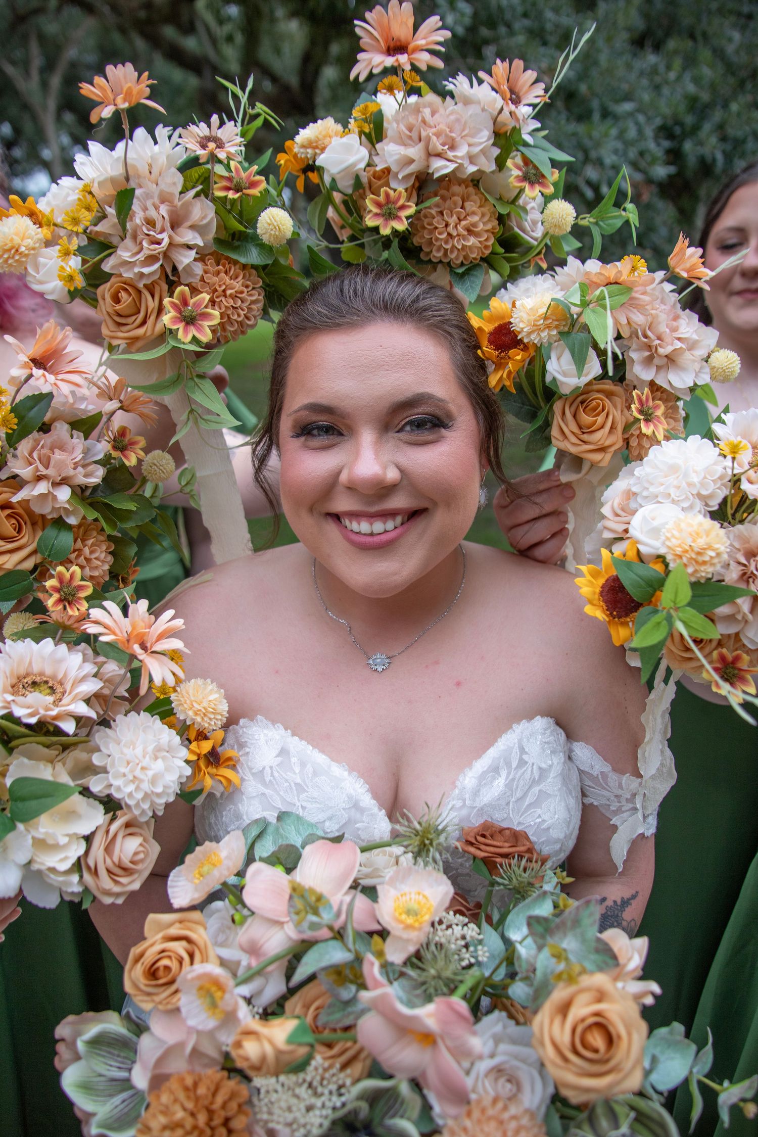 Beautiful floral arrangement featuring peach roses, dahlias and eucalyptus in a romantic wedding setting.