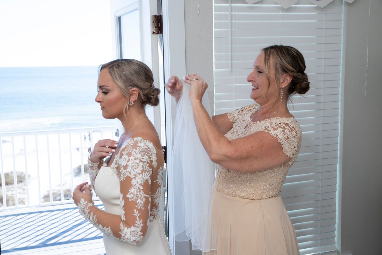 A series of bridal preparation photos showing someone getting dressed in a white lace wedding gown near windows.
