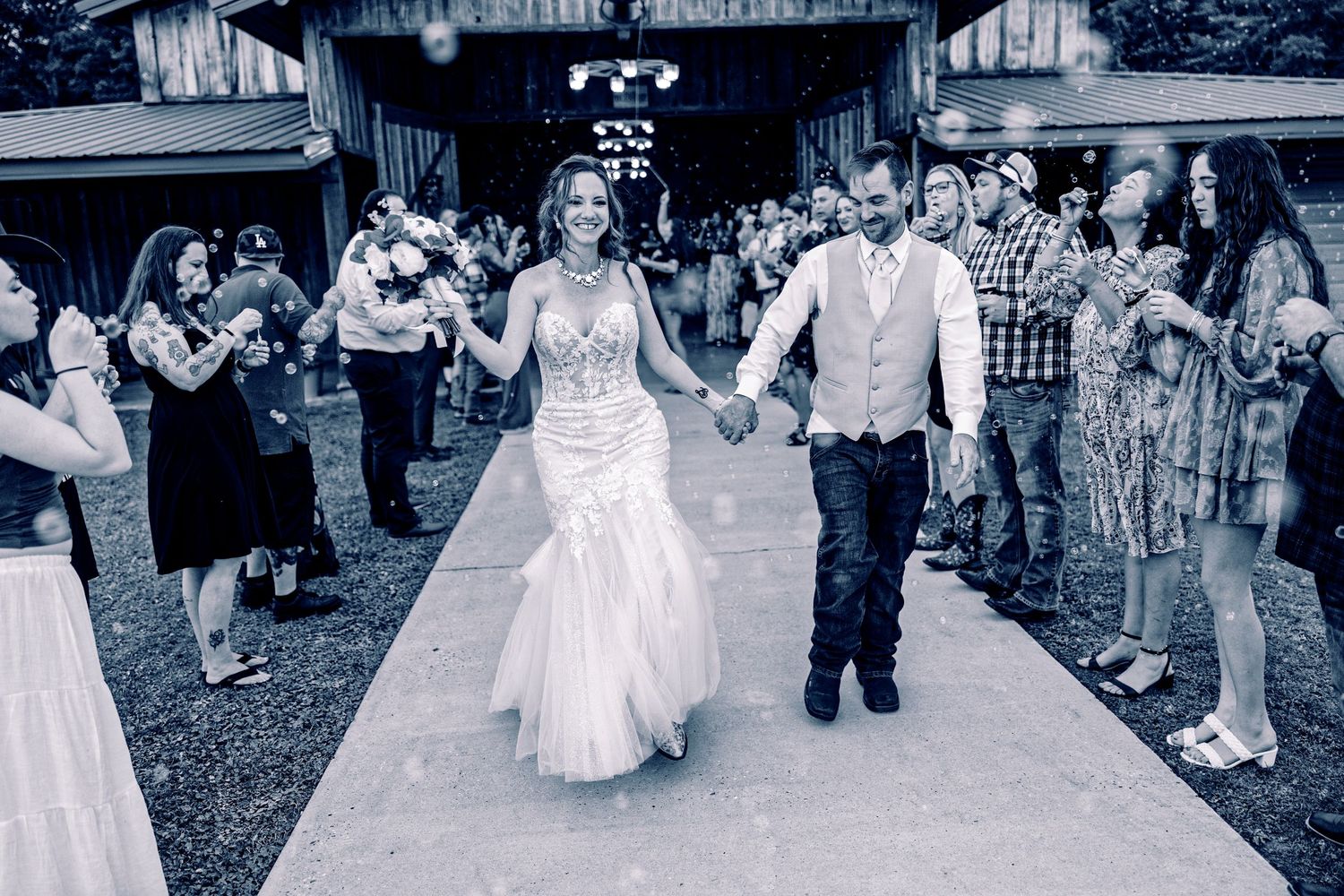 A group of people dancing at an outdoor event in vintage-style clothing and dresses.