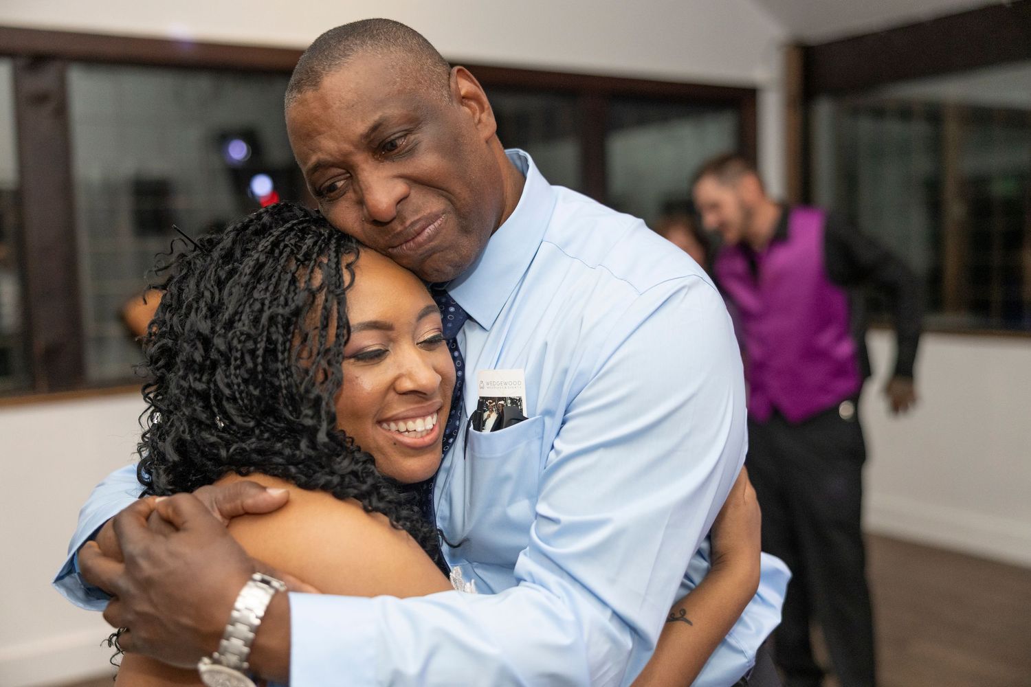 A series of five connected photos showing tender embraces and joyful moments in casual indoor settings.