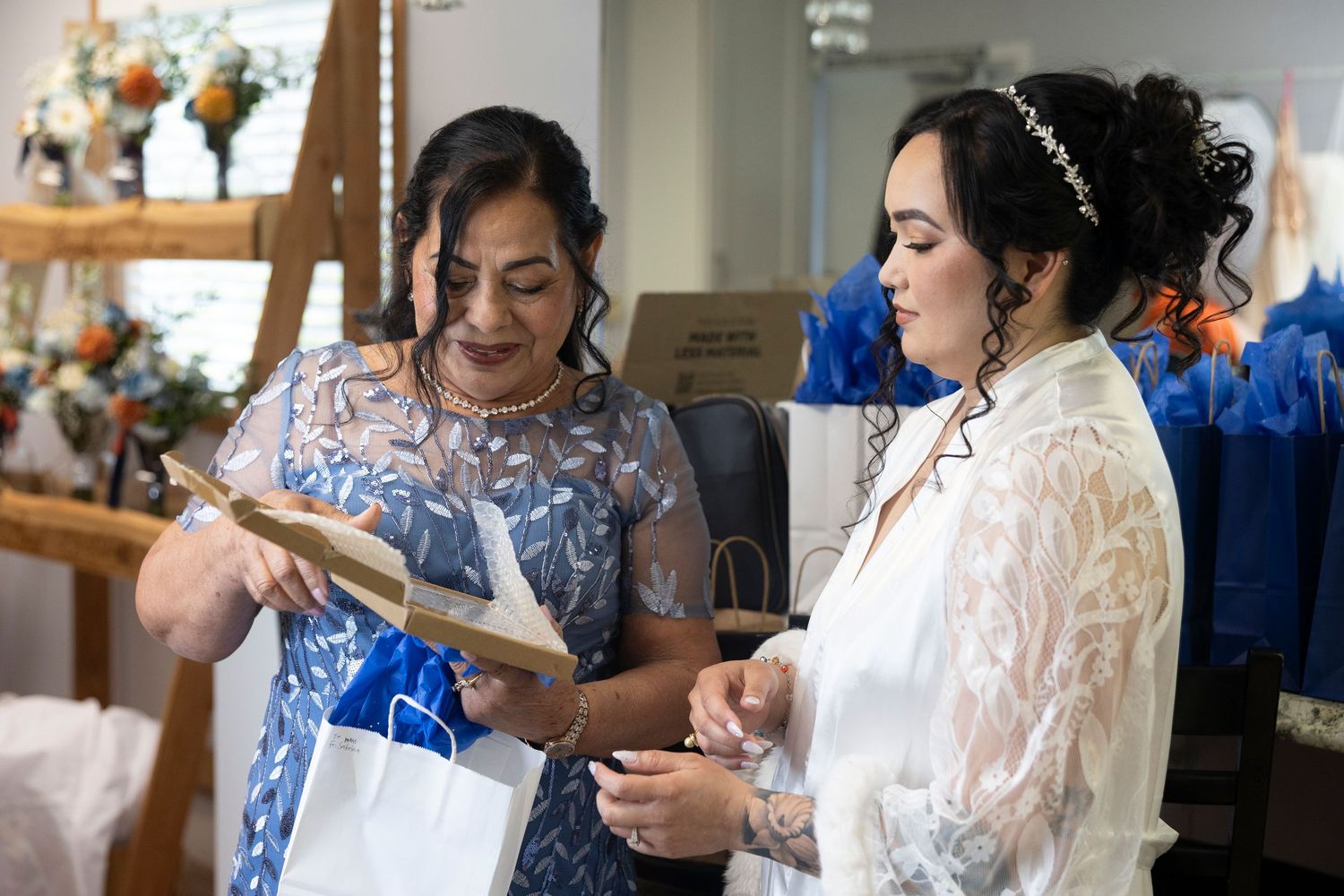 A series of photos showing people getting ready for a wedding, with lace details and blue accents visible throughout.