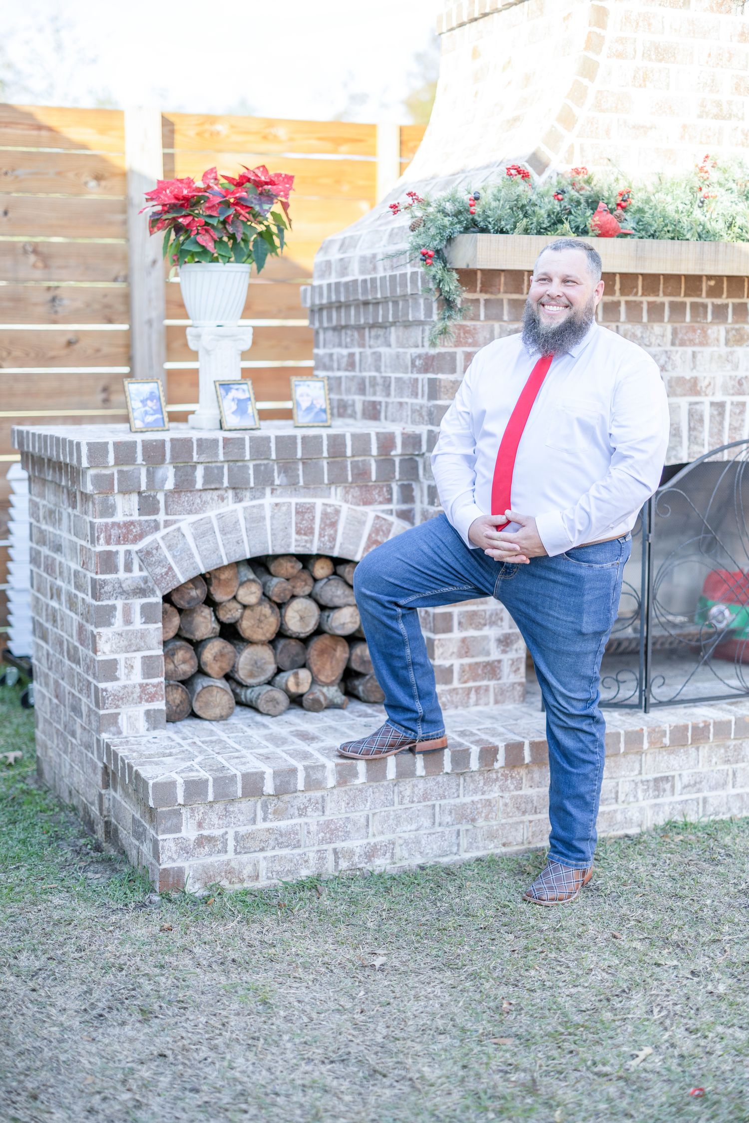 A series of outdoor photos showing someone in red suspenders and jeans sitting on a decorative brick wall near potted plants.