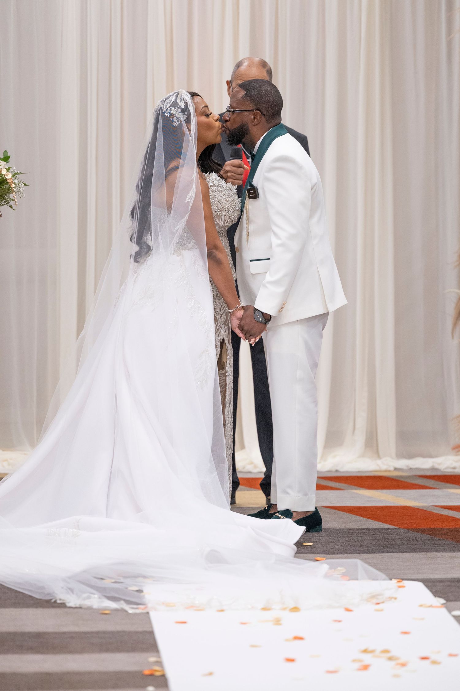 A sequence of wedding ceremony photos showing the bride and groom sharing their first kiss at the altar.