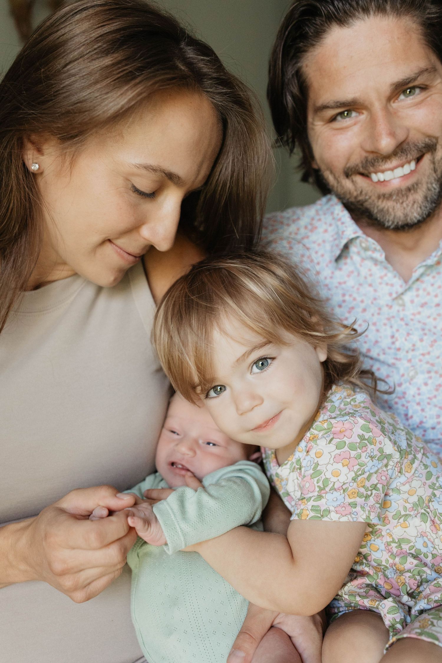 A heartwarming series of intimate family moments showing parents and child sharing affectionate cuddles and smiles.