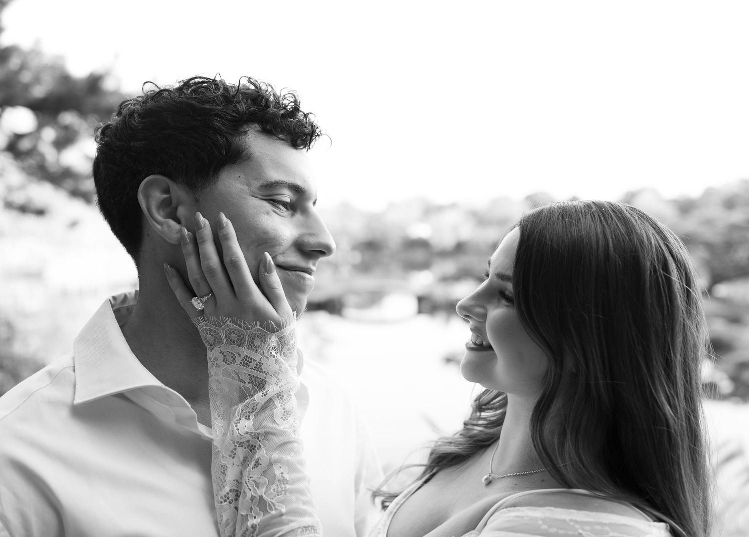 A black and white collage shows tender moments between a couple embracing outdoors.