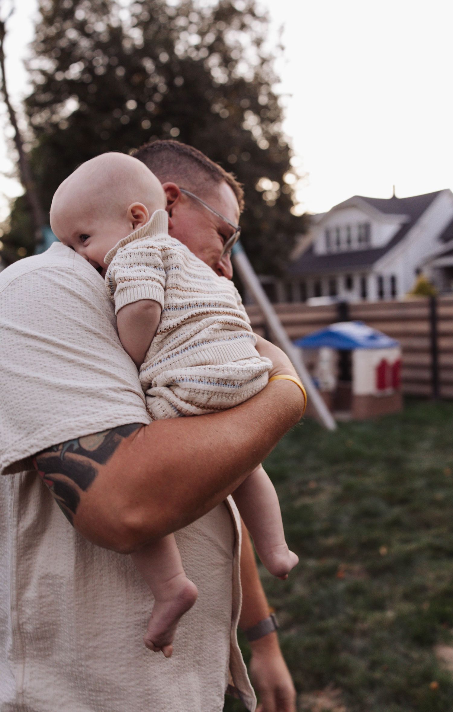 A series of tender moments captured between parent and child during outdoor playtime at dusk.