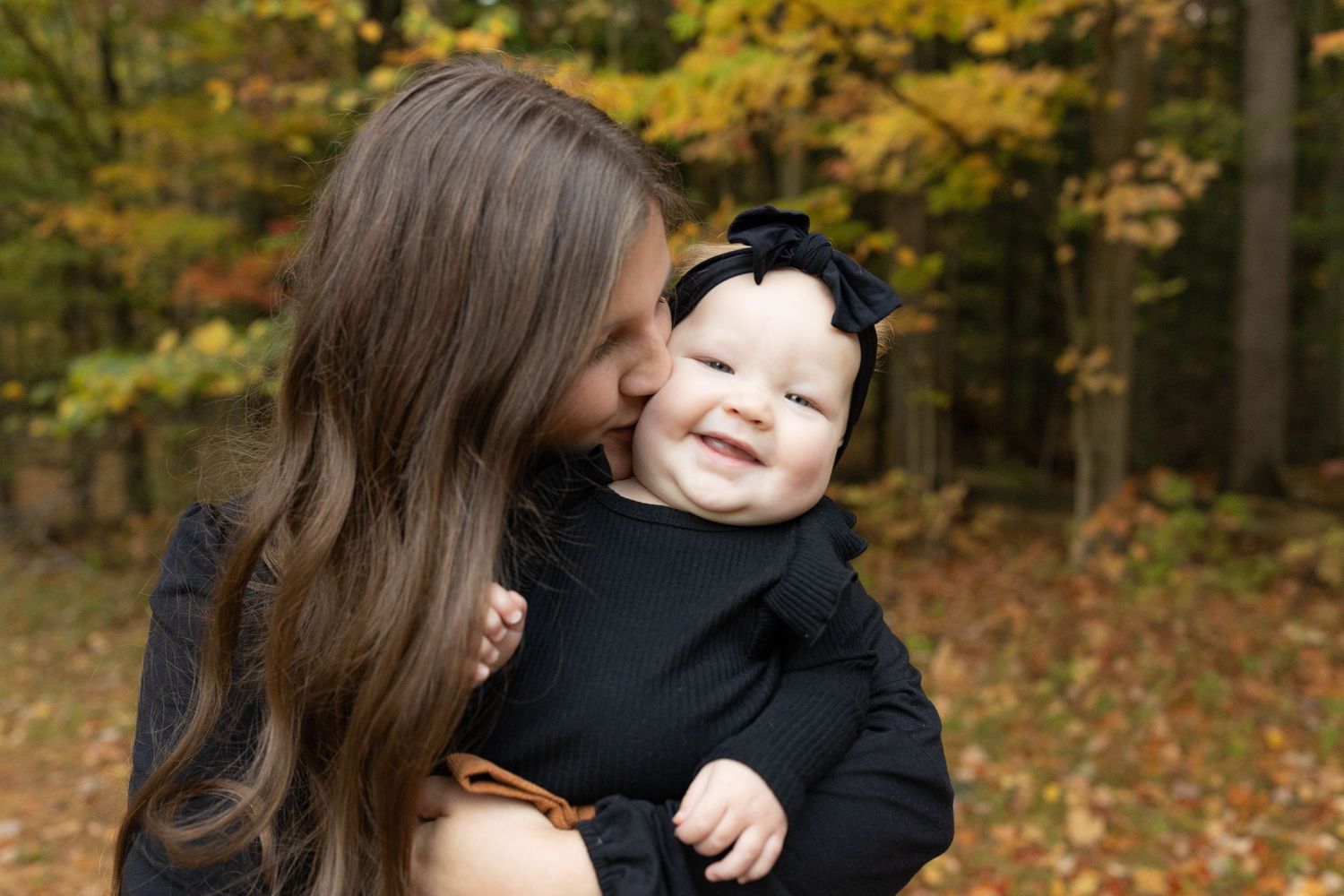 A series of autumn family photos showing joyful moments between loved ones in a forest setting with golden fall foliage.