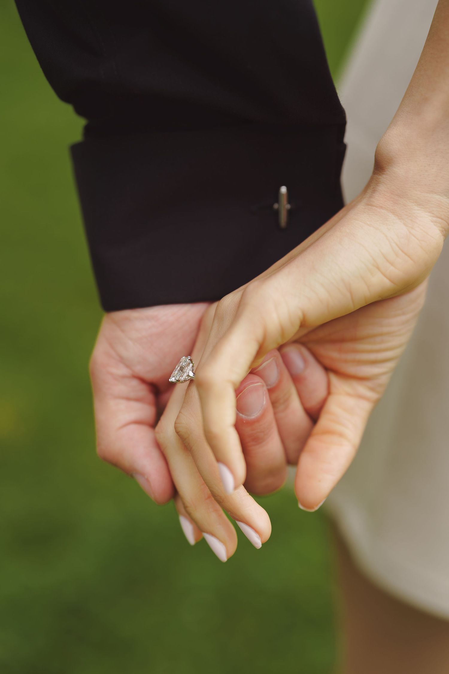 Close-up sequence of two hands coming together and holding, symbolizing unity, support, or emotional connection.