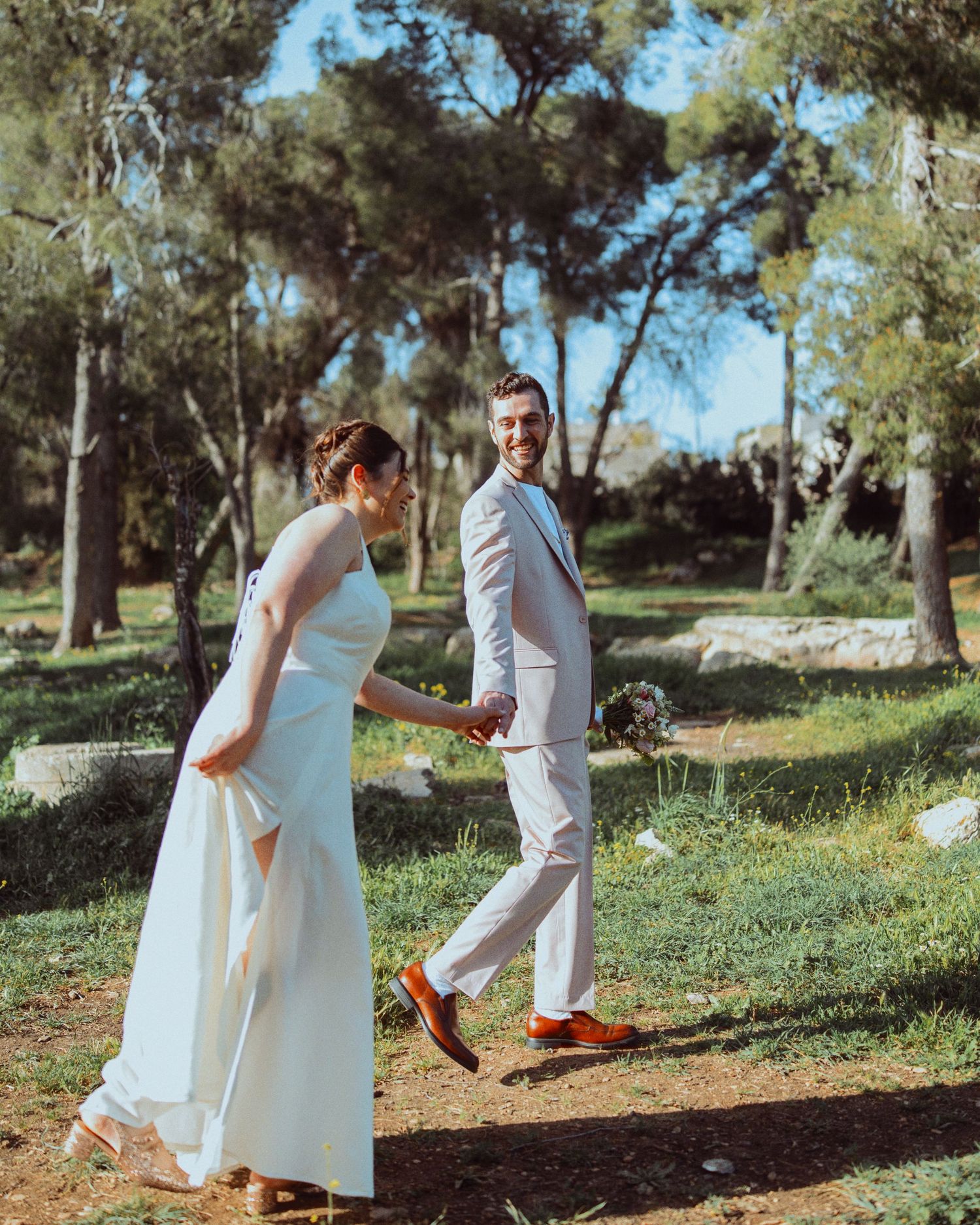 Playful wedding photo sequence in a natural outdoor setting with pine trees.