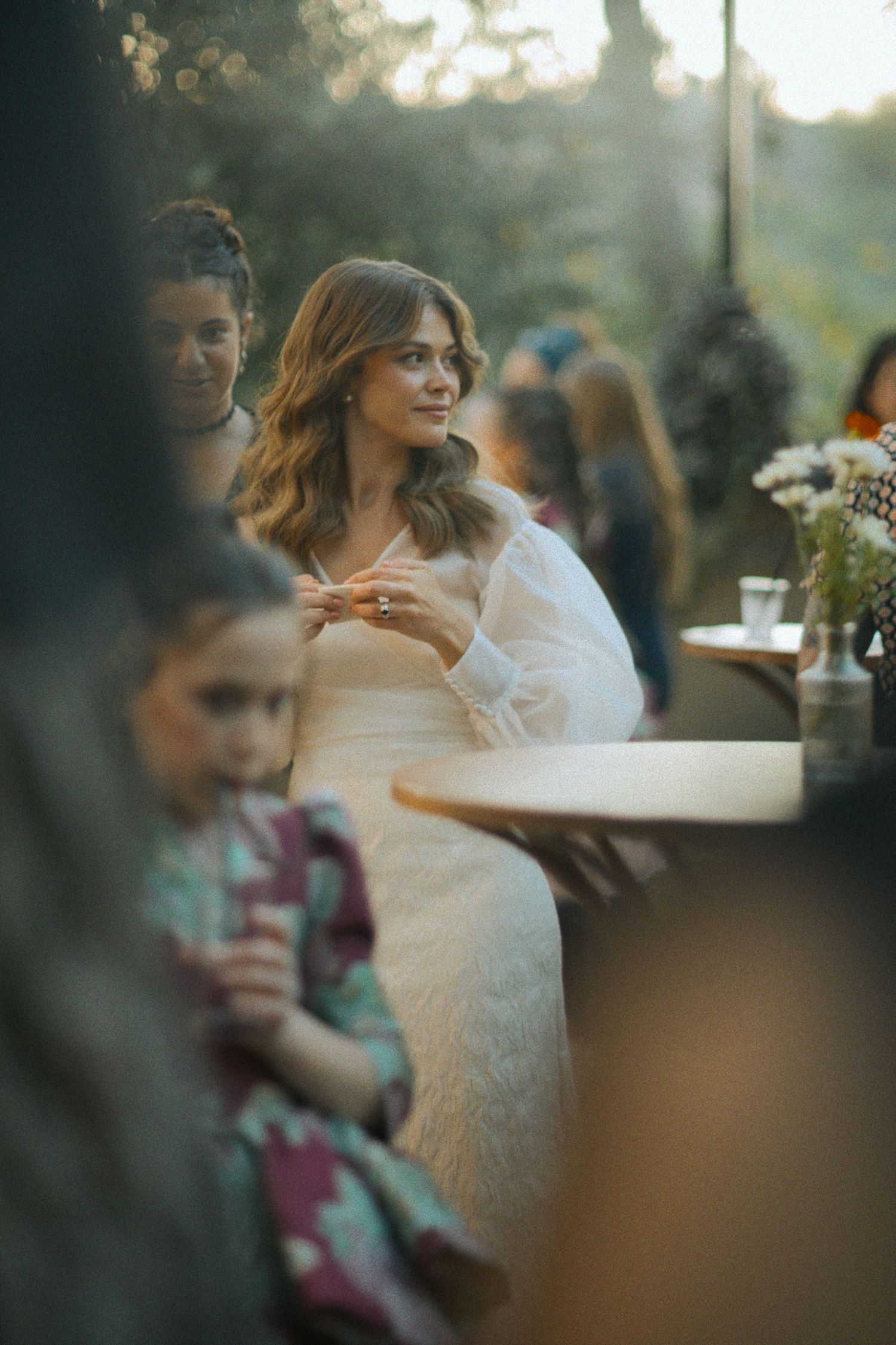 Artistic wedding photography with soft focus and natural lighting.