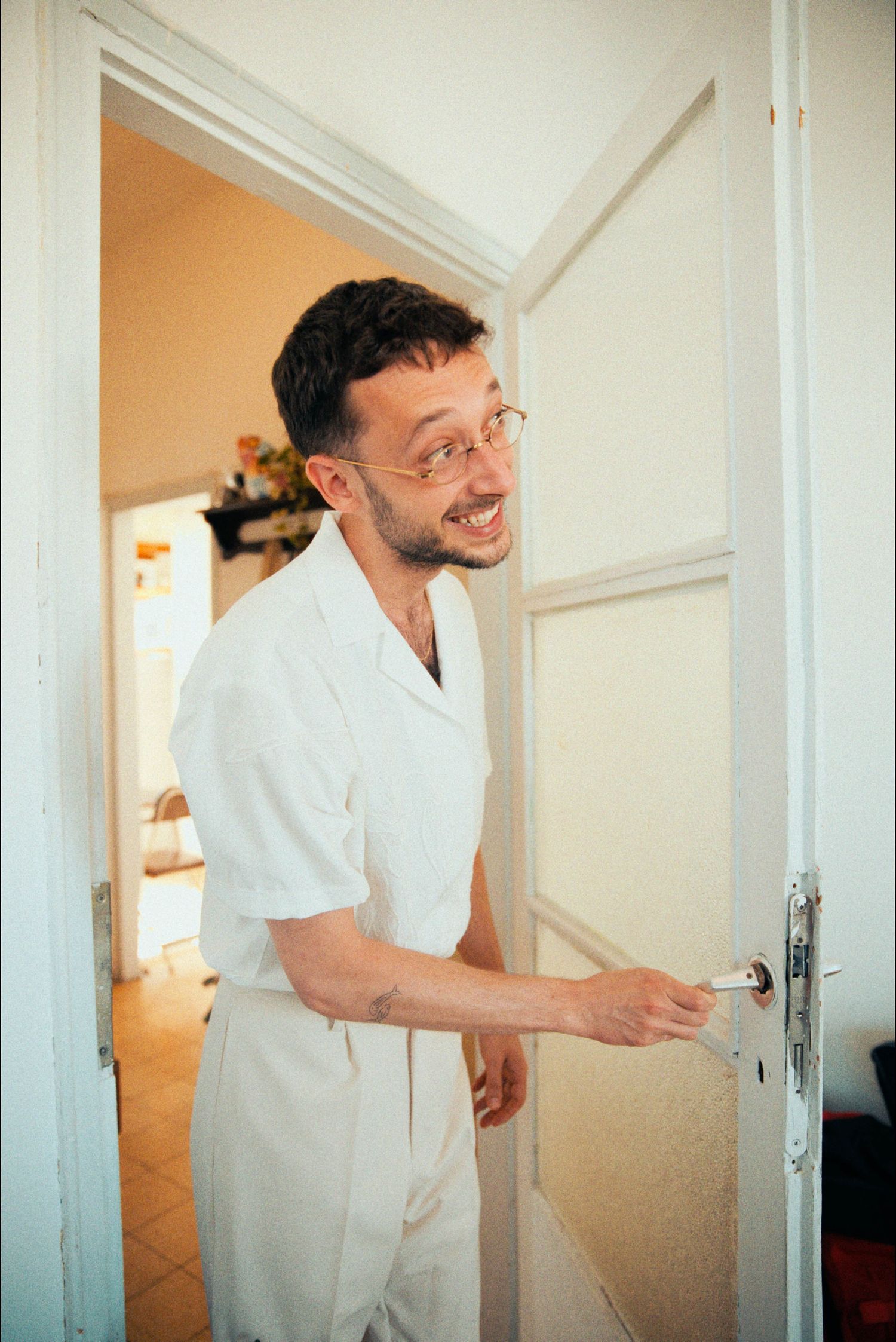 A series of playful poses showing movement and laughter in an indoor setting.