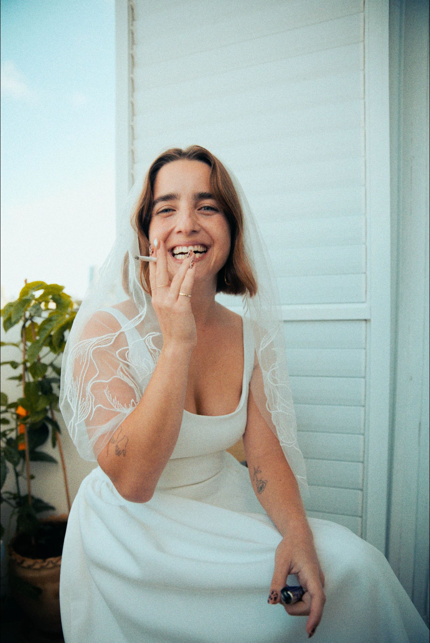 A joyful moment captured in a series of candid laughing expressions against a light background.