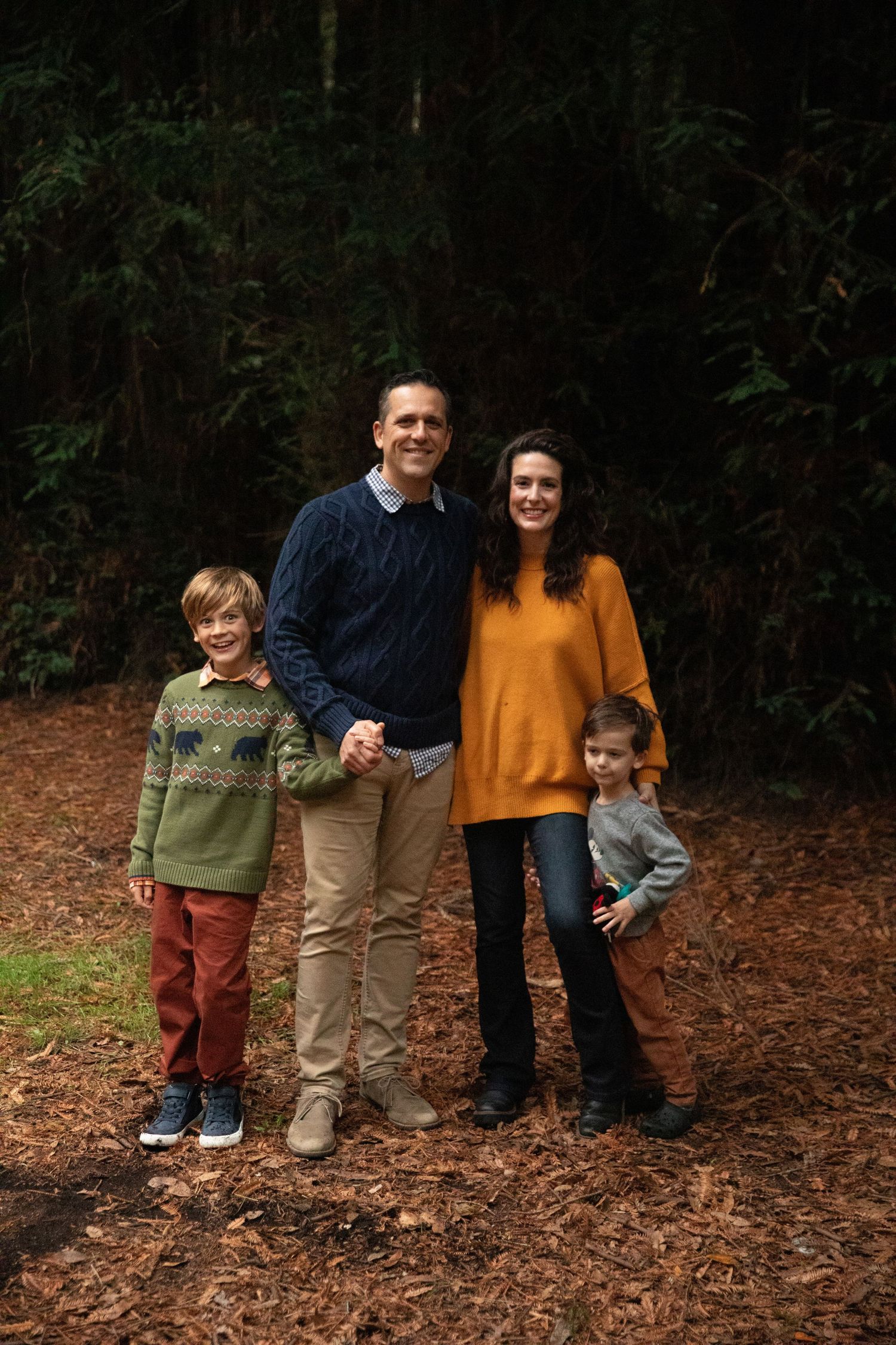 Family photo series on forest floor covered in fallen leaves.