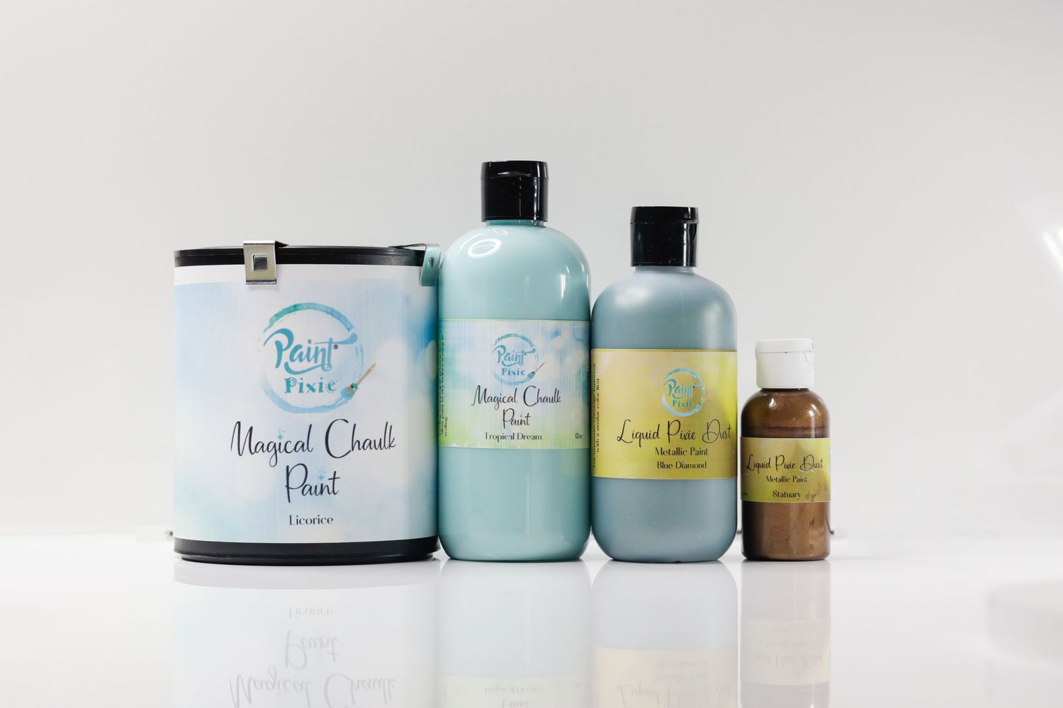 Collection of blue and mint colored hair care products displayed against white background.