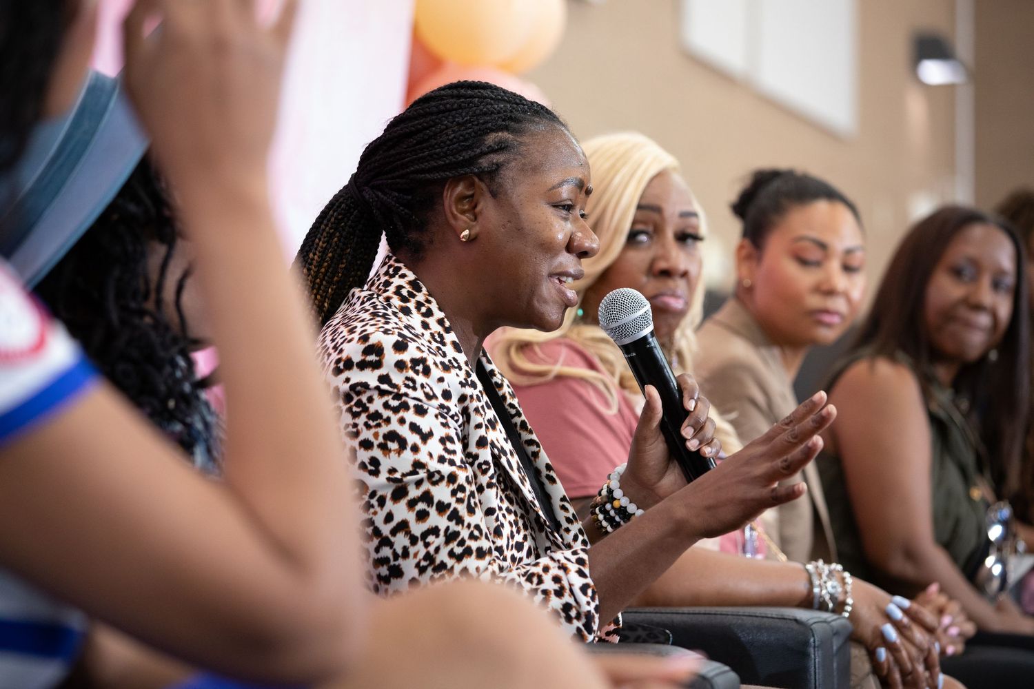 Audience members react enthusiastically during an engaging event presentation.
