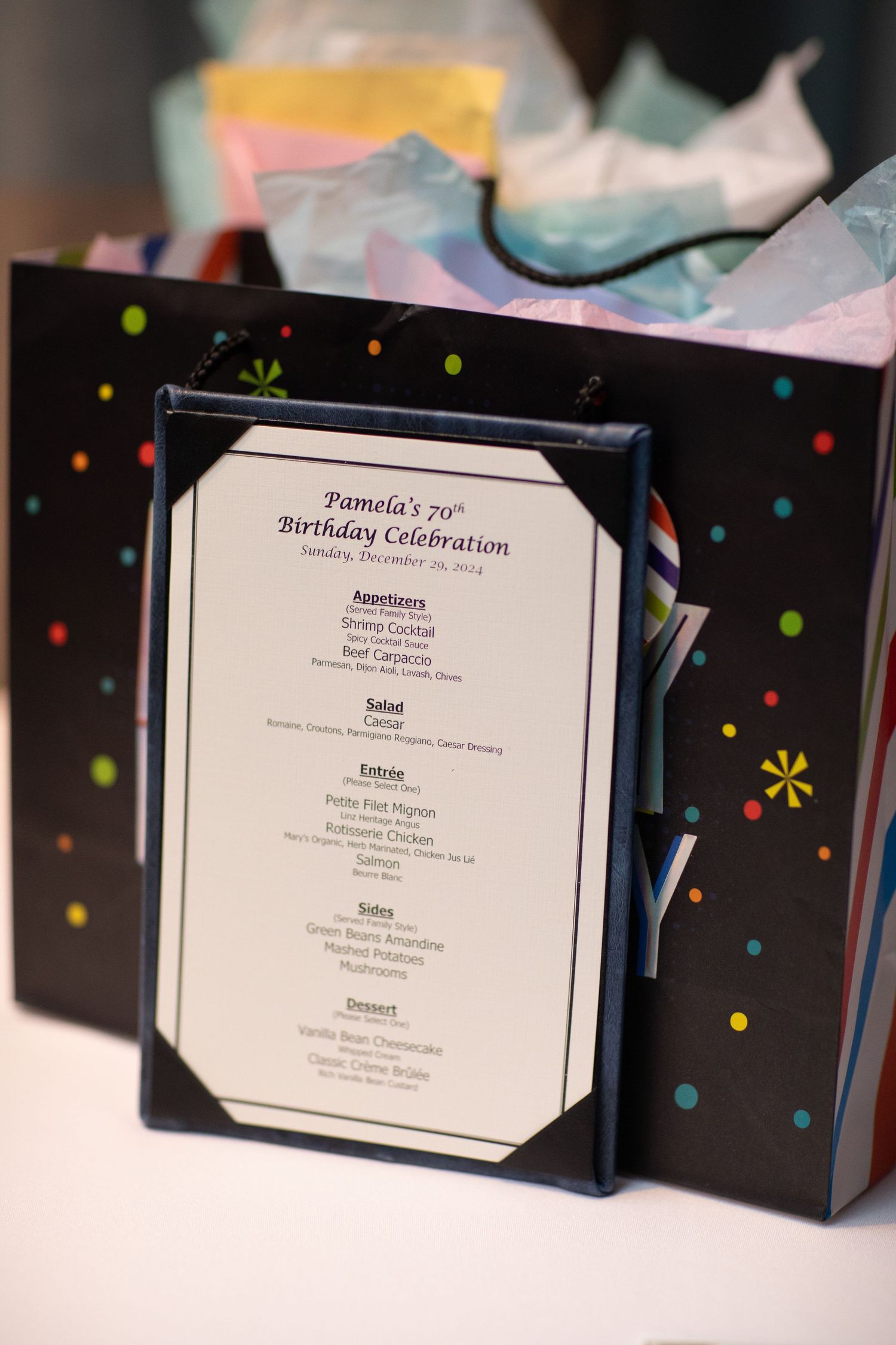 Black celebration menus with colorful polka dot patterns displayed in a row.