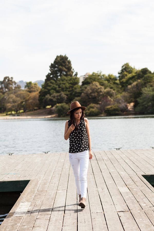 Fashion photography sequence on wooden dock with water and trees in background.