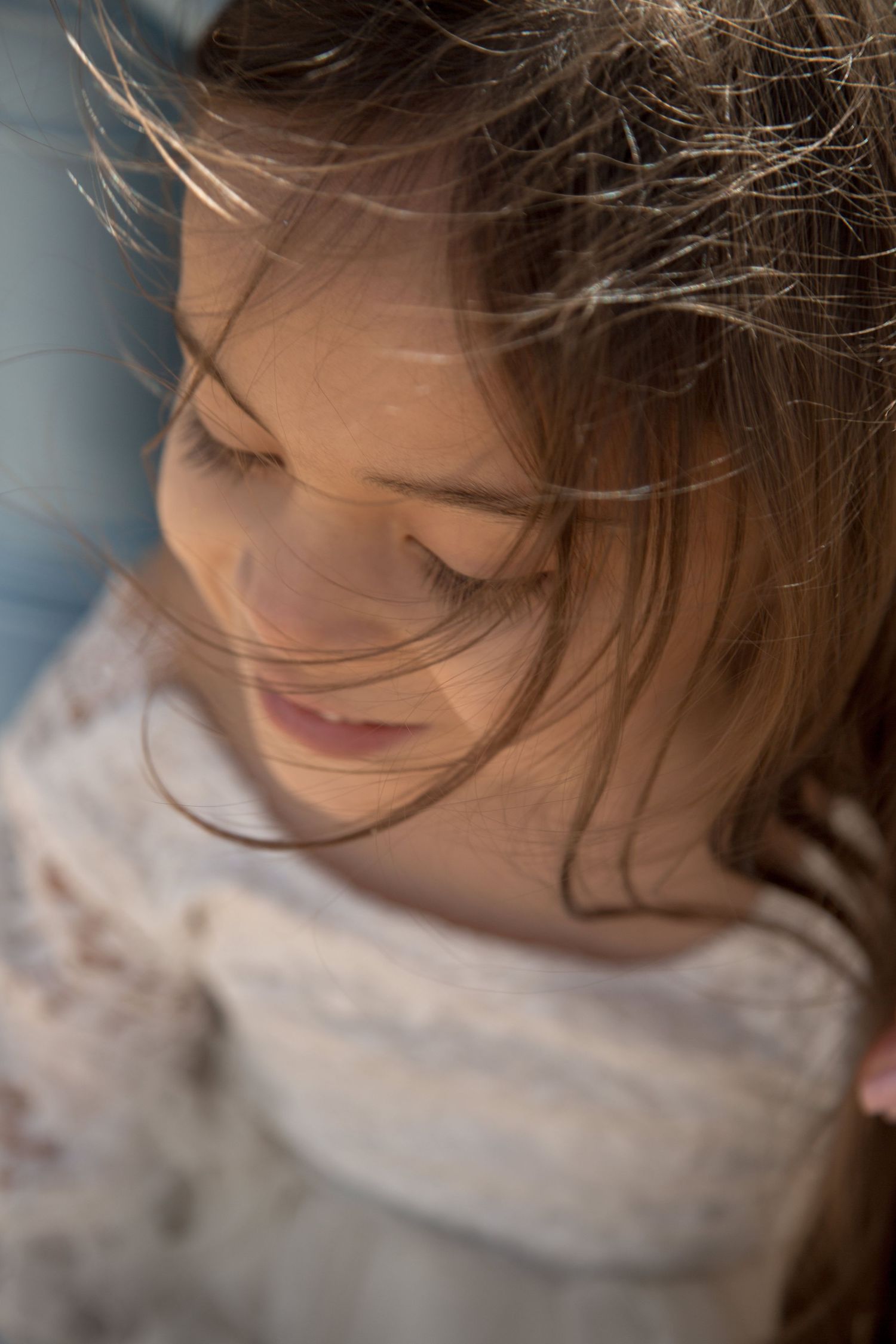 Artistic close-up shot showing soft feminine details in natural lighting.