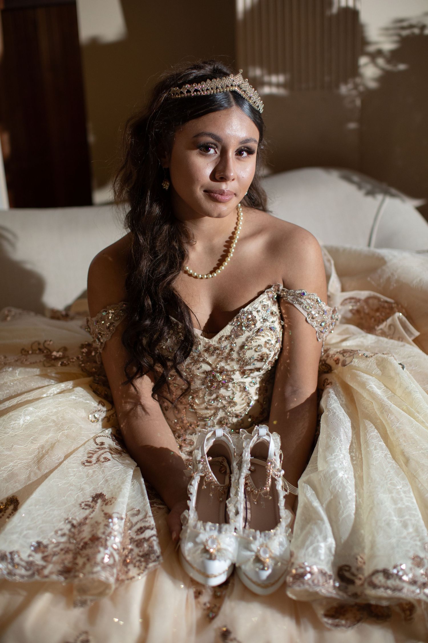 An elegant portrait showcasing a formal gown and crystal shoes for a special celebration.