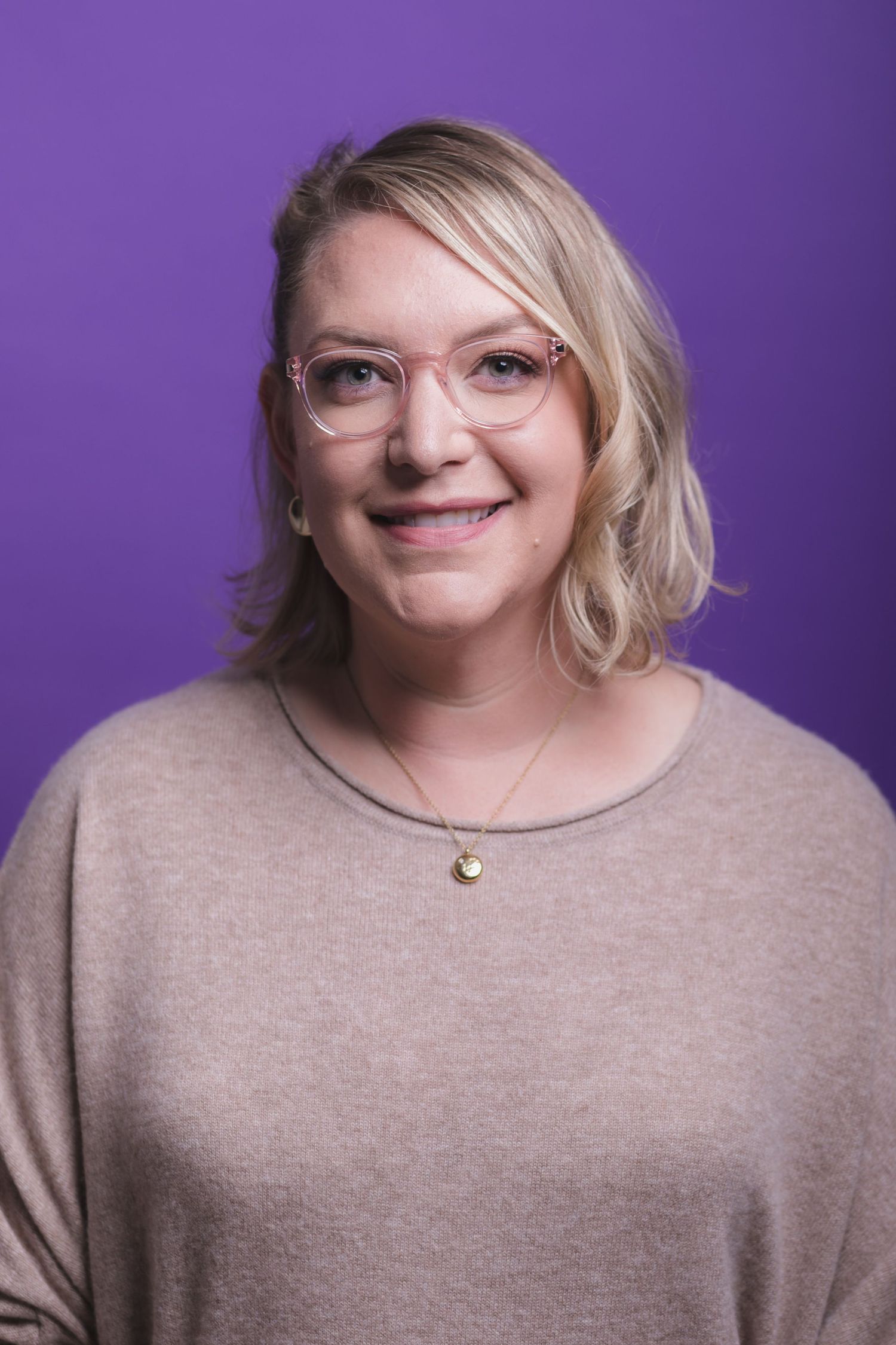 Portrait series of person in beige sweater against purple background.