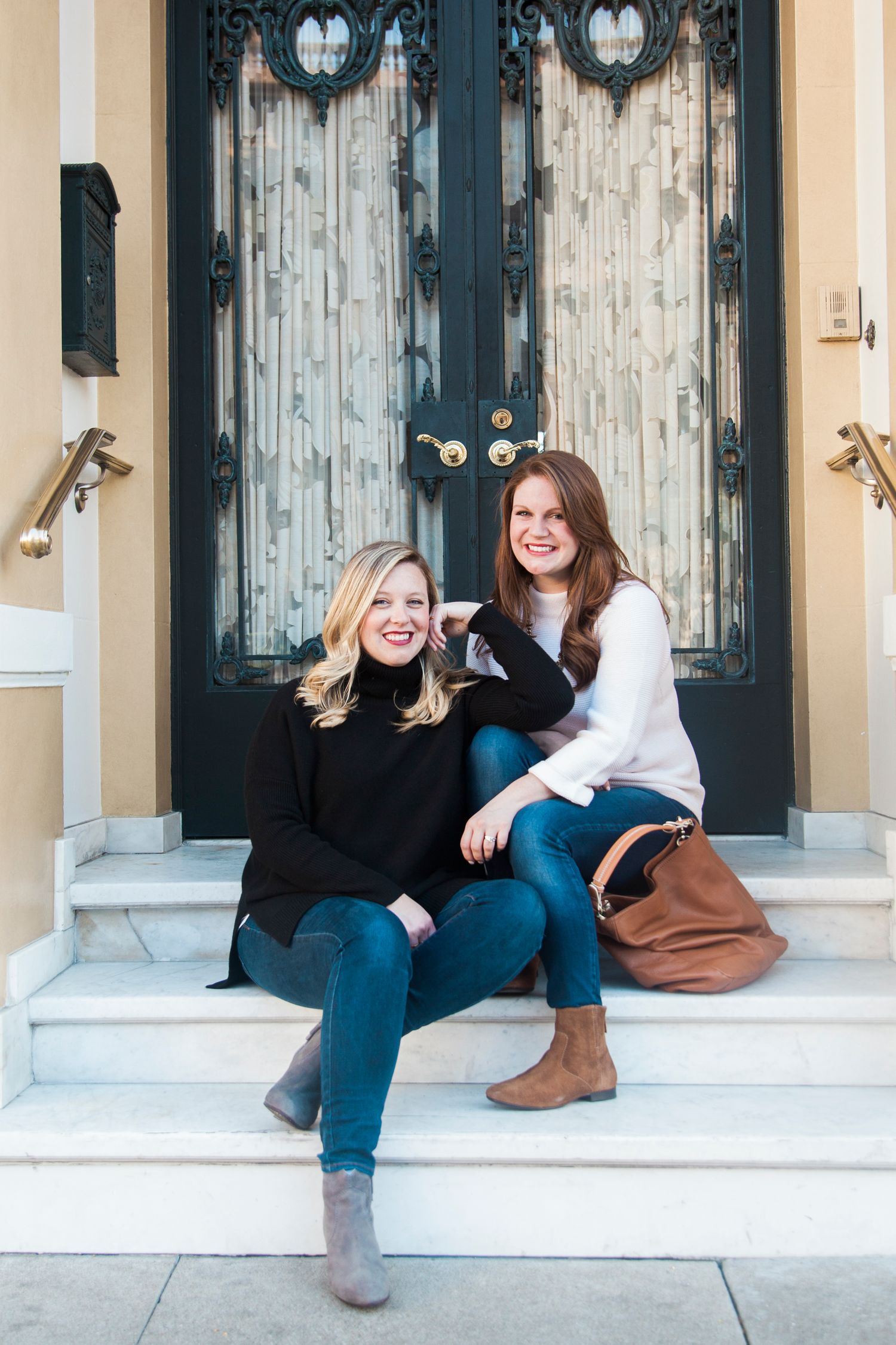 Casual portraits on a building's front porch with vintage blue doors.