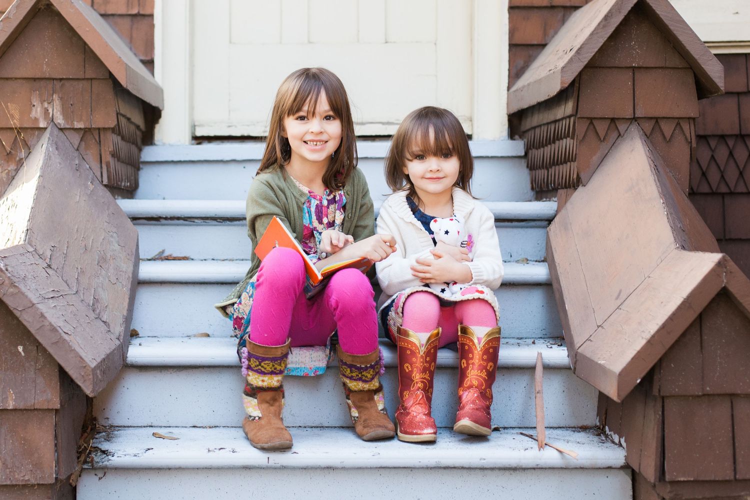 A cozy scene on rustic stone steps with boots and casual sitting poses.