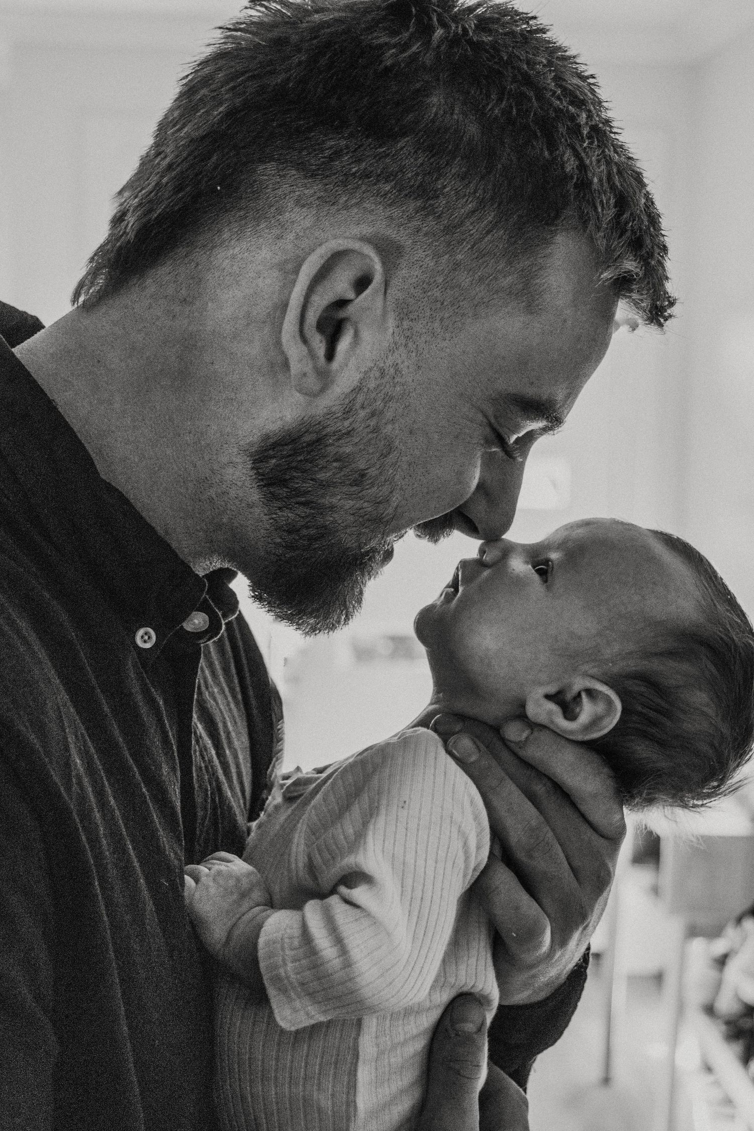 newborn baby photo session. Father and son